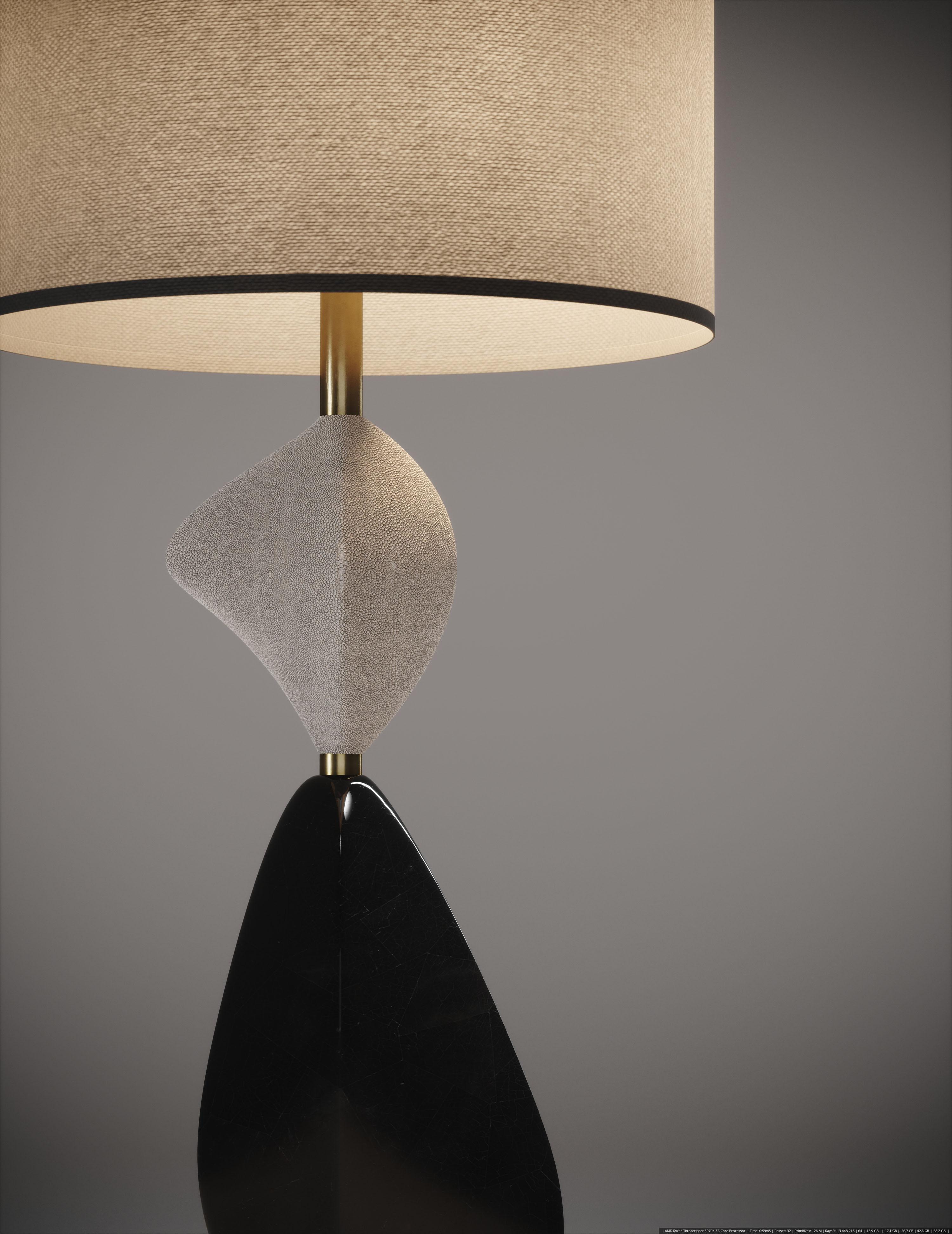 The Cosmo III table lamp by Kifu Paris is a whimsical and sculptural piece, inlaid in cream shagreen and black pen shell with bronze-patina brass accents. This piece is a sister to the original Cosmo Lamp by Kifu Paris, see images at end of slide.