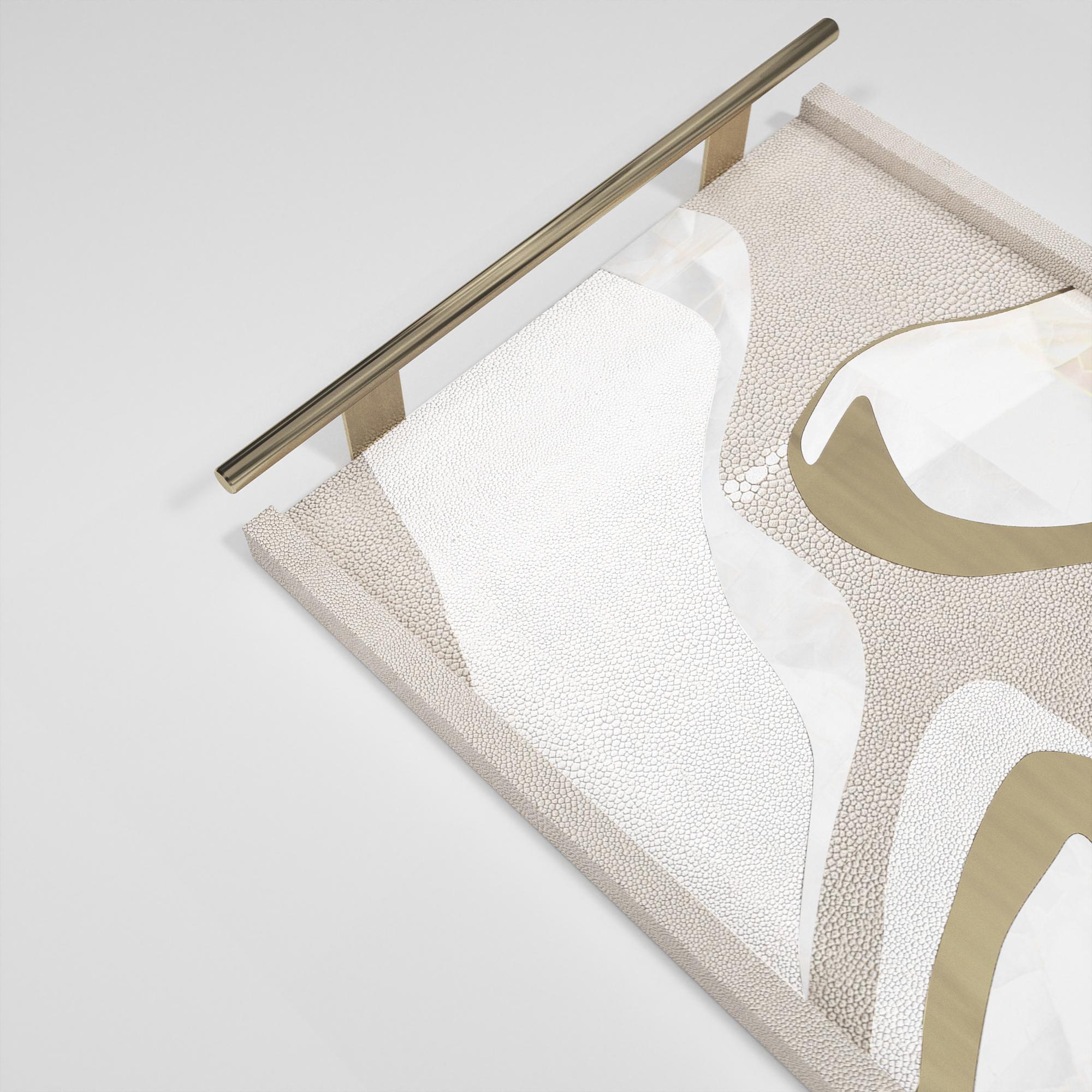 A classic rectangle tray revisited; this Kifu Paris Chital II tray inlaid in a mixture of shagreen, shell and bronze-patina brass, makes for a stunning tabletop piece in any space. The brass handle are tubular. Available in other sizes & finishes