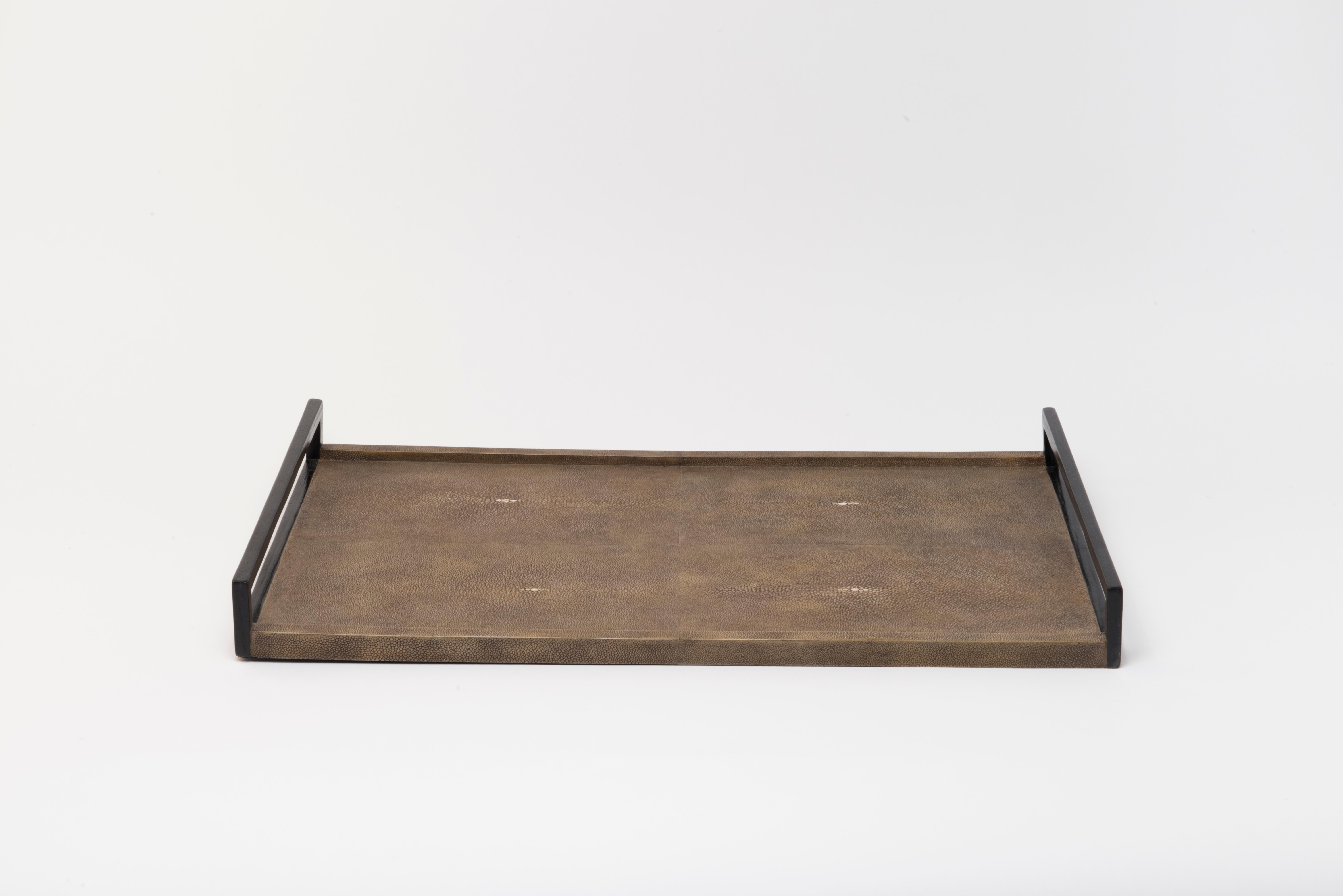 This tray is a luxurious update to the classic piece. Available in other finishes and sizes.

· Handmade

· Shagreen, black wood veneer handles 

· Measures: 61 x 34 x 1.3 cm 

All R & Y Augousti pieces are handmade by artisans, ultimately