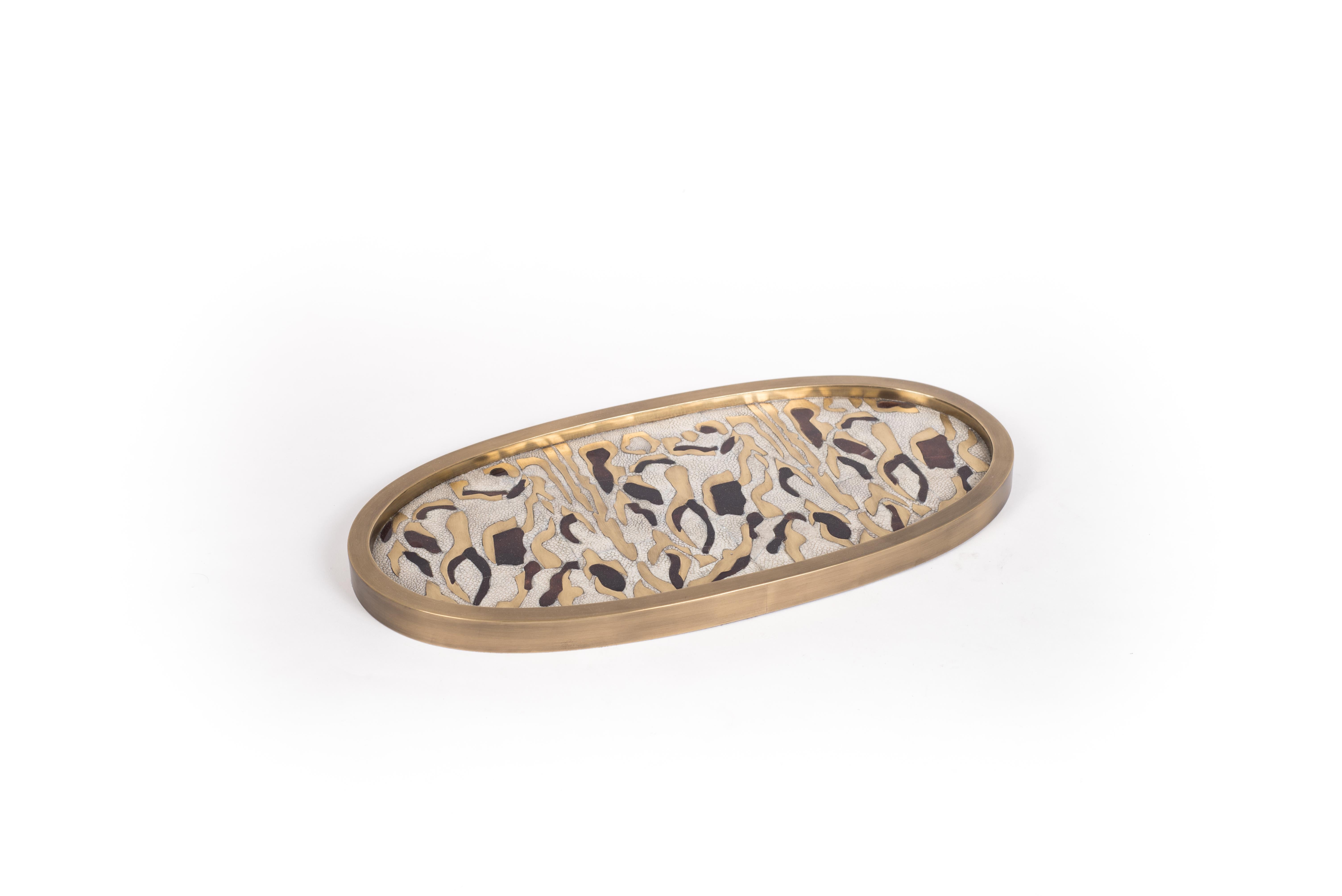 A Classic oval vanity tray revisited; this Kifu Paris leopard pattern tray is inlaid in a mixture of cream shagreen, brown shell, and bronze-patina brass, making for a stunning tabletop piece in any space. The frame is inlaid in bronze-patina brass.