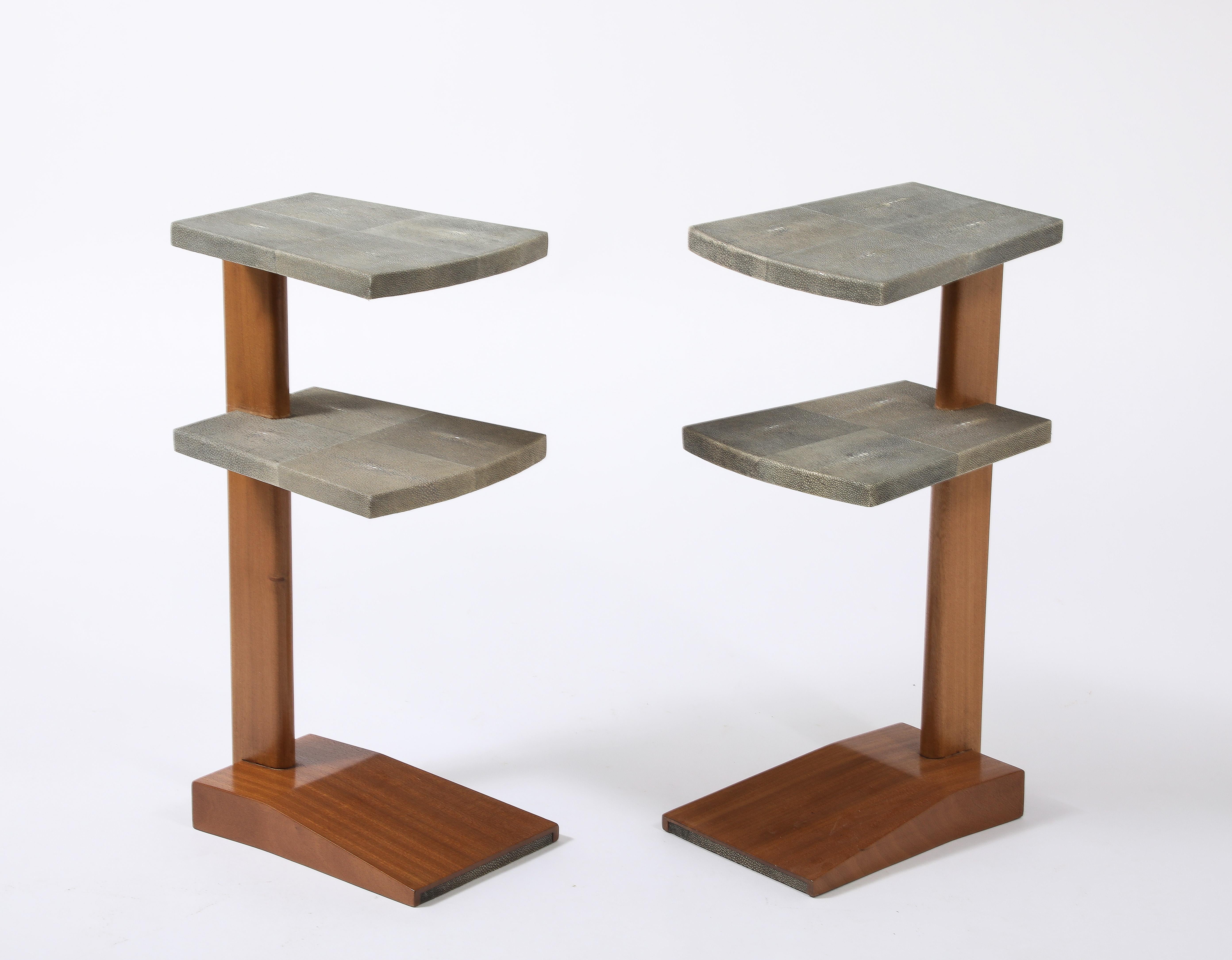 Two-tiered walnut table clad in Celadon-colored shagreen.