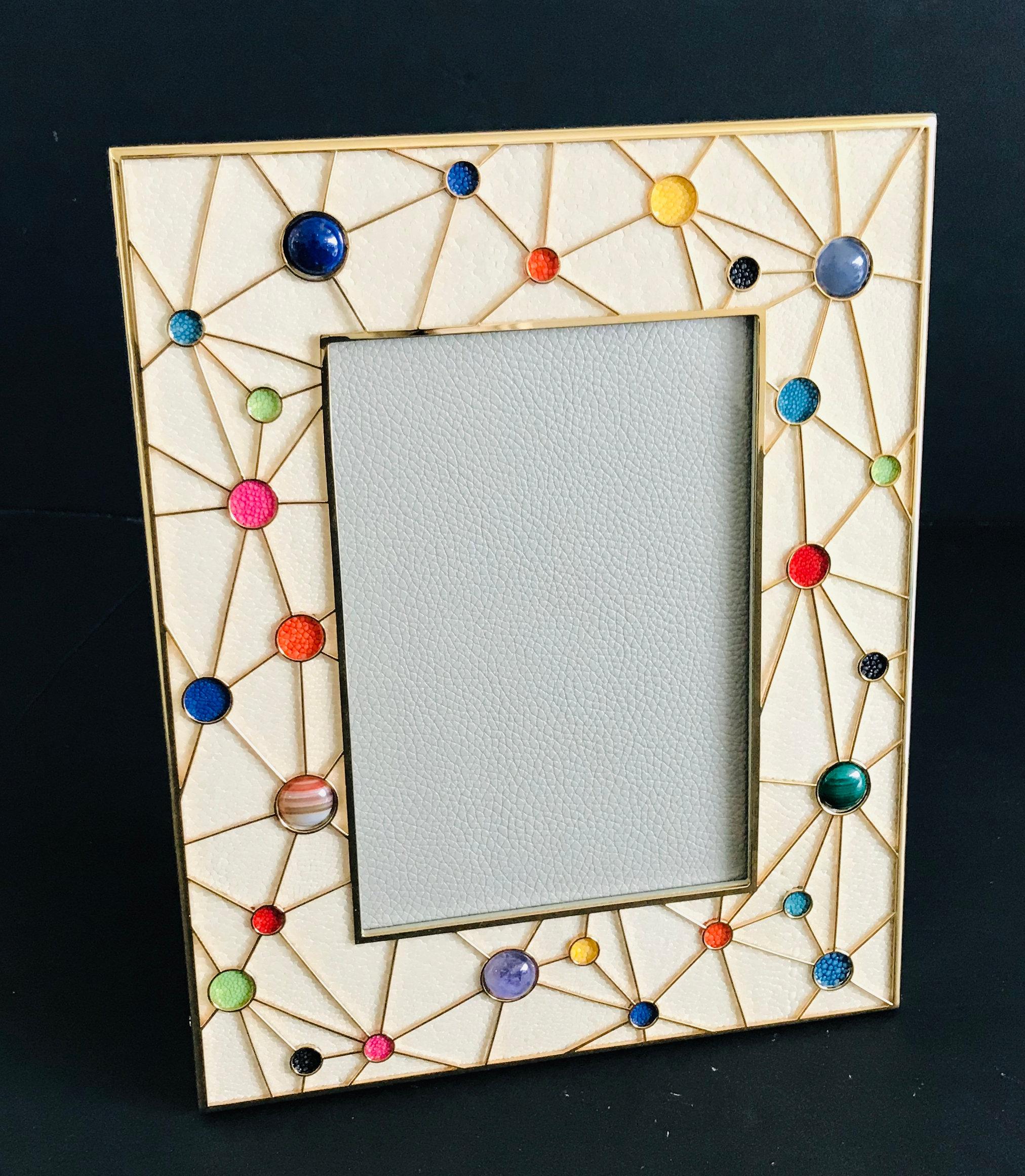 Ivory shagreen with multi-color stones and gold-plated picture frame by Fabio Ltd
Height: 10.5 inches / Width: 8.5 inches / Depth: 1 inch
Photo size: 5 inches by 7 inches
1 in stock in Palm Springs
Order Reference #: FABIOLTD PF41
This piece makes