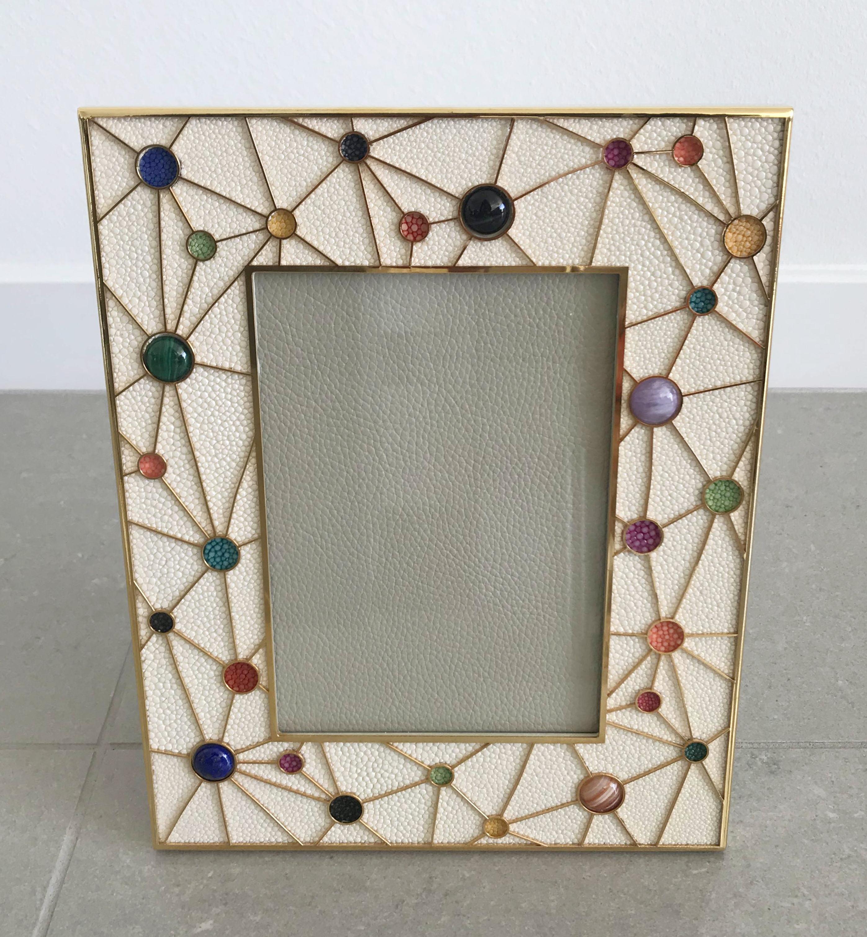 Ivory shagreen leather with multi-color stone inserts and gold-plated picture frame by Fabio Ltd
Measures: Height 10.5 inches, width 8.5 inches, depth 1 inch
Photo size: 5 inches by 7 inches
LAST 1 in stock in Los Angeles
Order Reference #: FABIOLTD