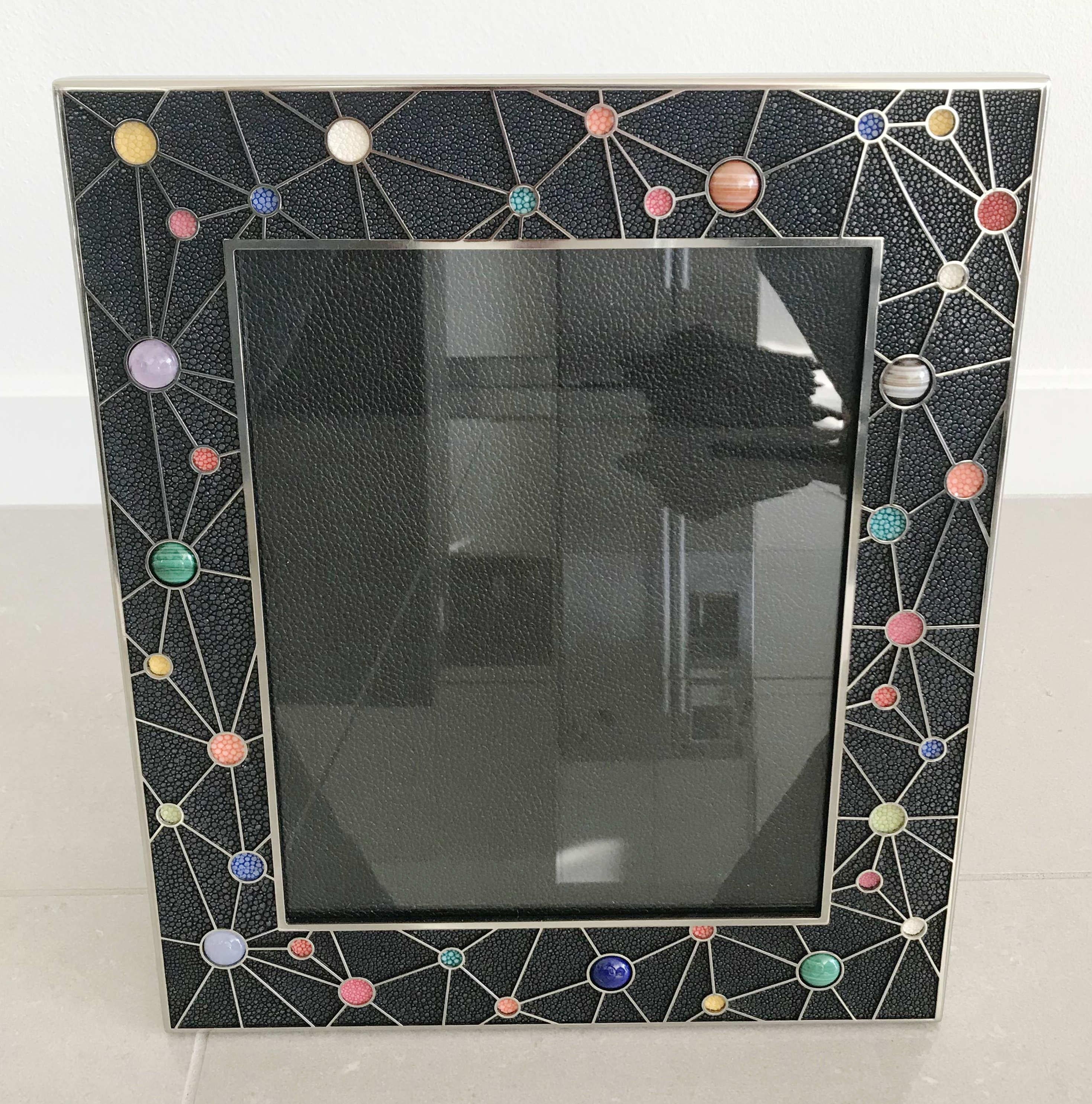 Black shagreen leather with multi-color stone inserts and nickel-plated picture frames by Fabio Ltd
Measures: Height 13.5 inches, width 11.5 inches, depth 1 inch
Photo size 8 inches by 10 inches
LAST 2 in stock in Los Angeles
Order Reference #: