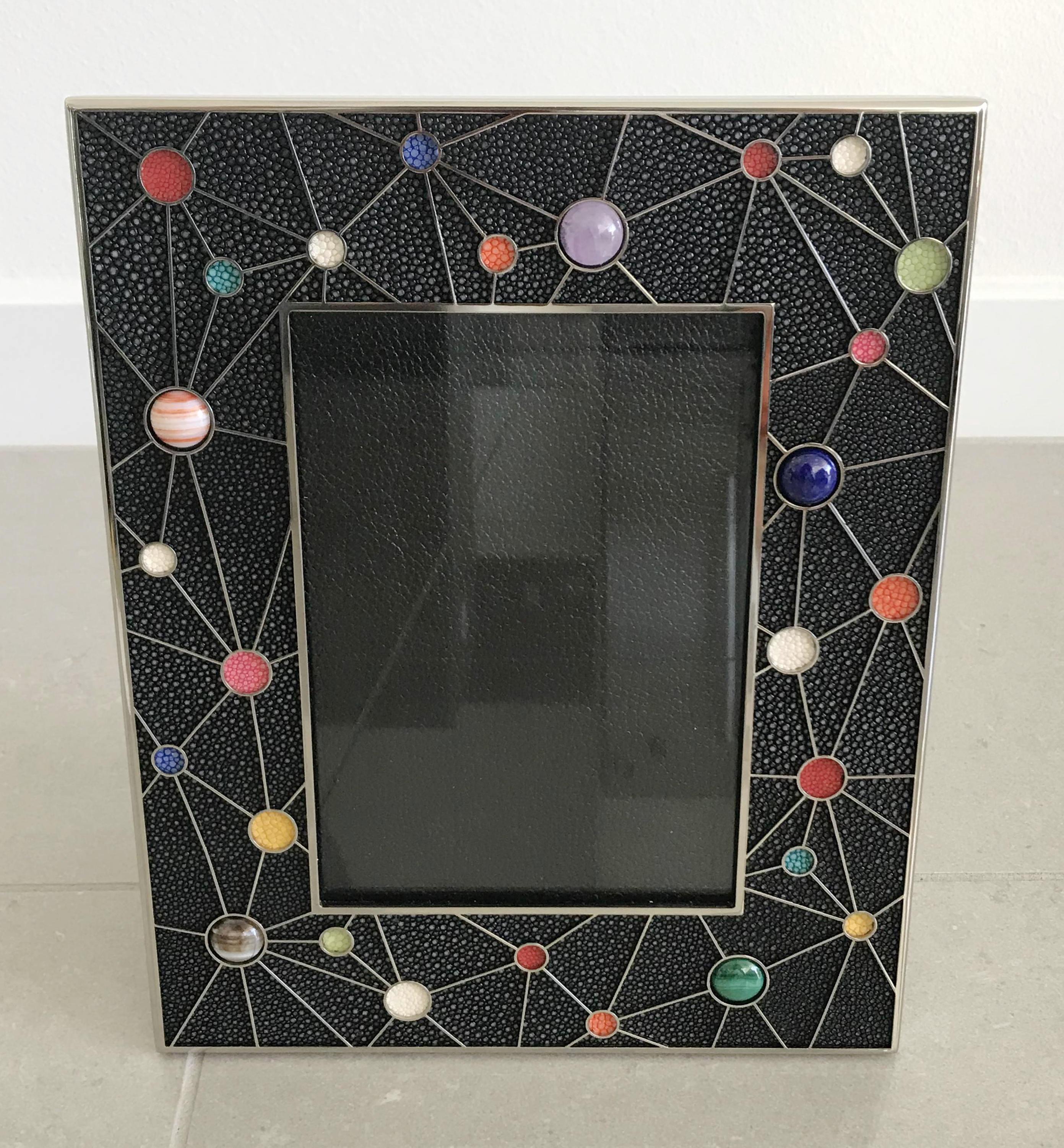 Black shagreen leather with multi-color stone inserts and nickel-plated picture frames by Fabio Ltd
Measures: Height 10.5 inches / width 8.5 inches / depth 1 inch
Photo size: 5 inches by 7 inches
LAST 2 in stock in Los Angeles
Order Reference #: