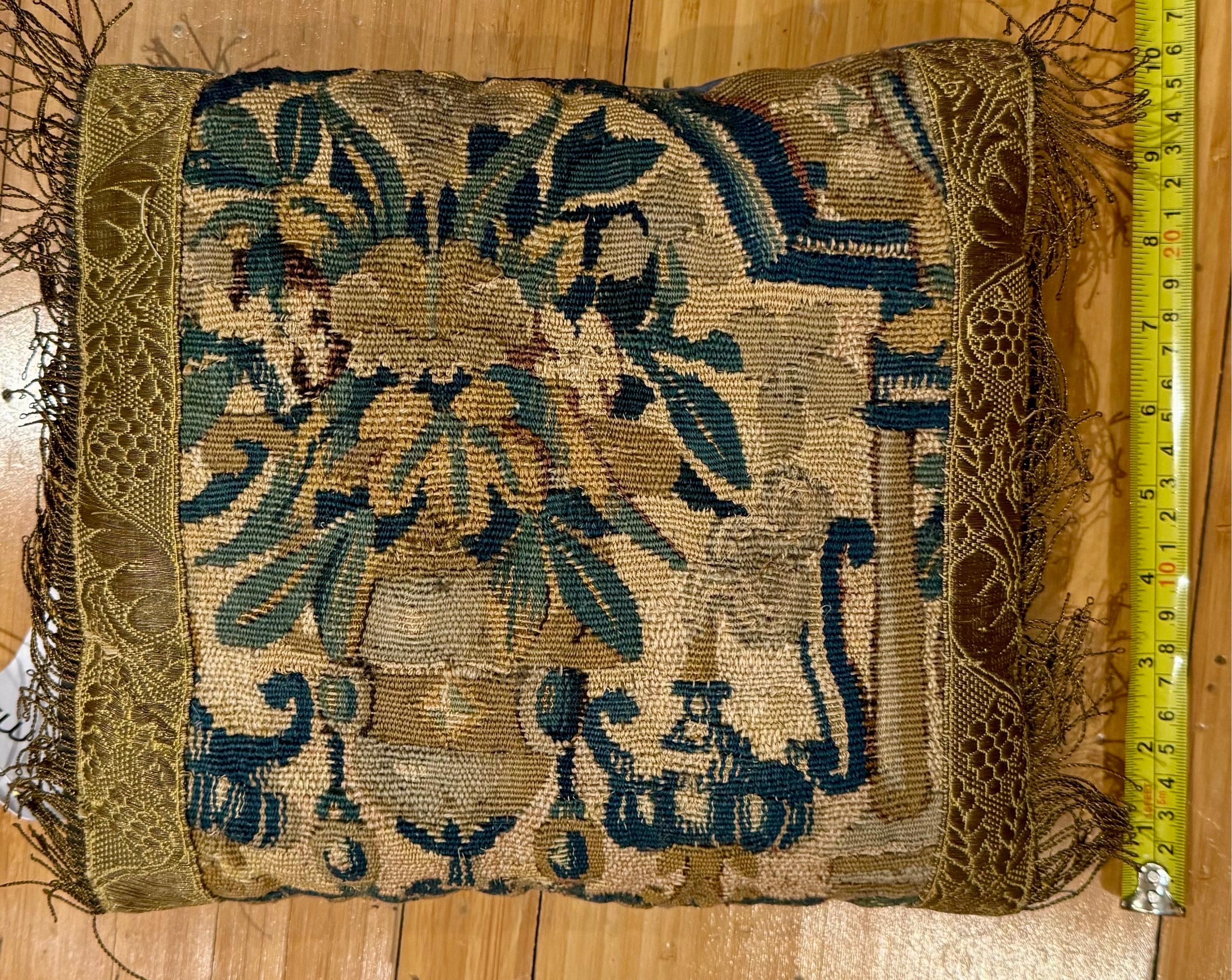 Stunning 17th Century Verdure Tapestry pillow with foliage that will brighten up any sofa, canapé or settee! Tan velvet backing in excellent condition. It measures 10 x 11 inches.

Complimentary Shipping in the Continental US!