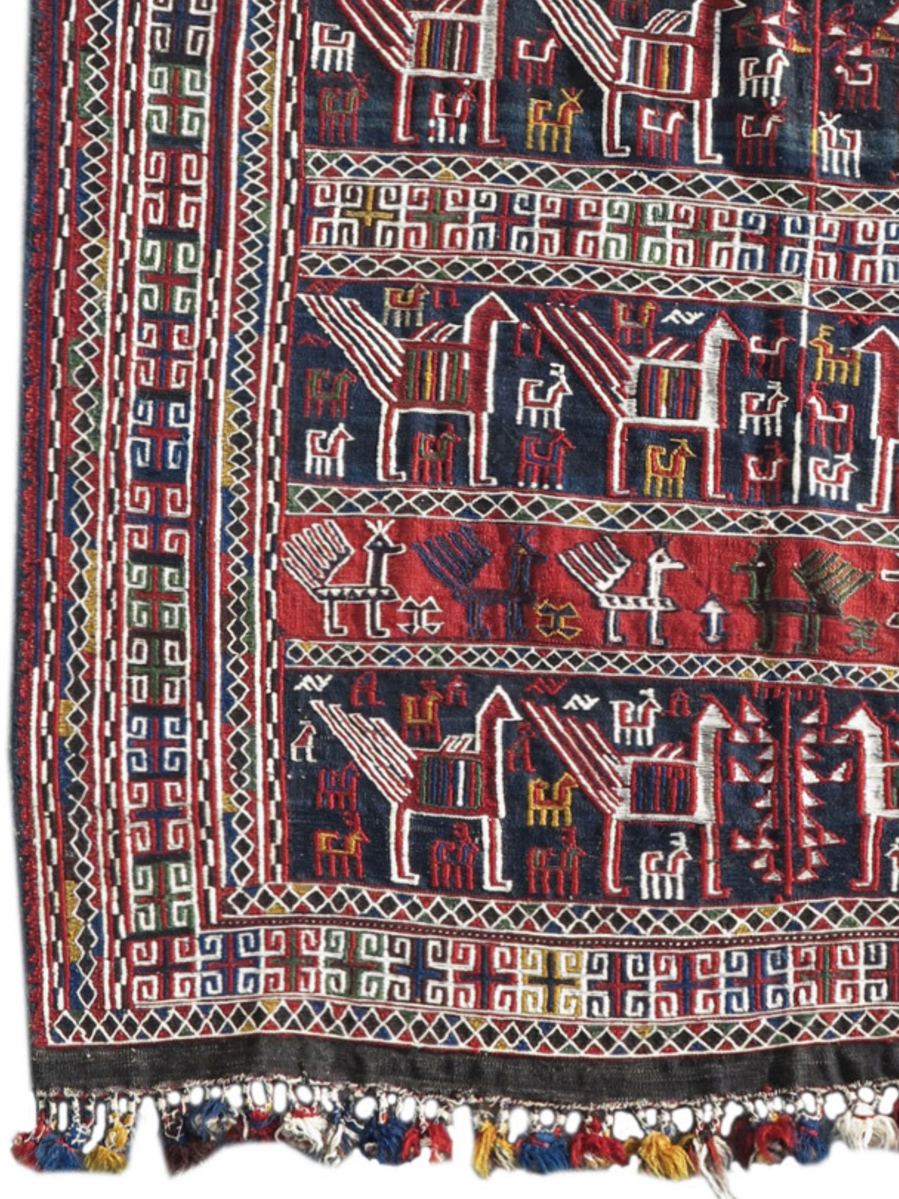 Shahsevan Pferdedecke, um 1900

Diese lebhafte Pferdedecke zeichnet Reihen von paradierenden Tieren über krapprote und indigoblaue Streifen. Verschiedene Arten von Vögeln, darunter auch Pfauen, sowie zweideutige Vierbeiner, sind durchweg festlich