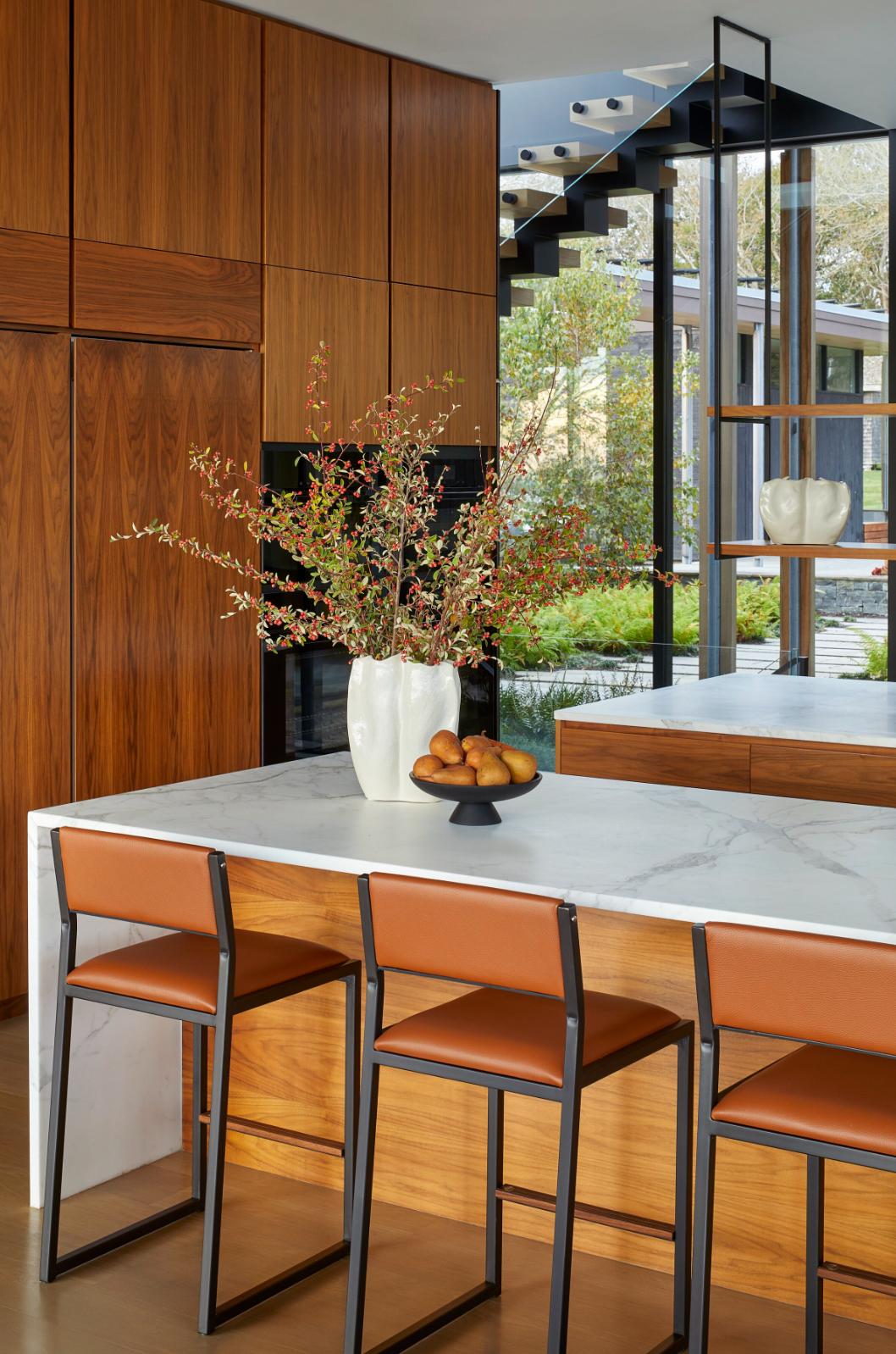 The shaker modern counter stool chair is handmade to order. Featuring our optional Luxurious Blackened steel frame and a Genuine leather seat and back. Also offered in COM or COL. Inspired by the boarding ladder steps of an old boat. The anti-slip