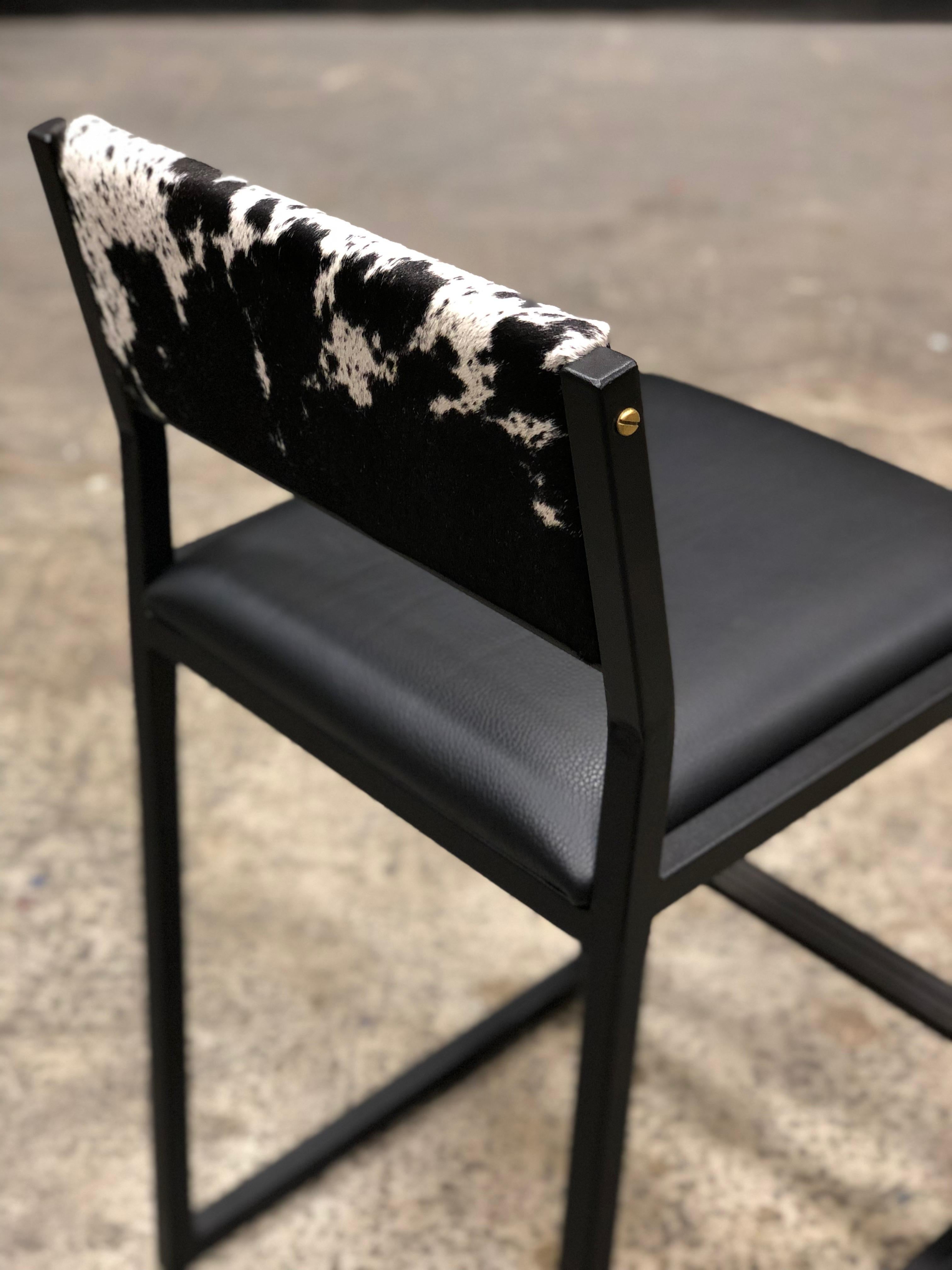 black and white cowhide bar stools
