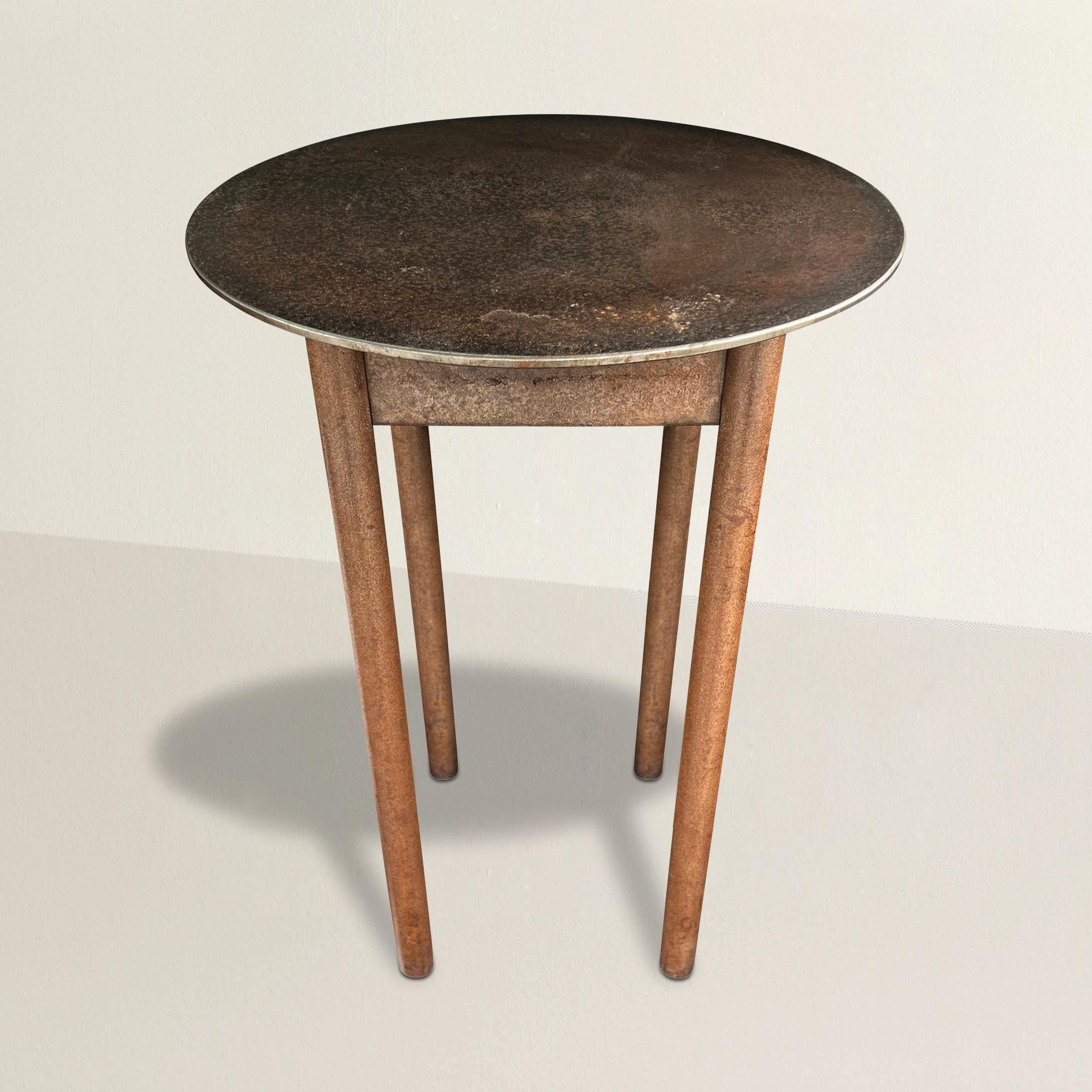 A simple but sophisticated American Shaker-inspired steel side table with a round top supported by four round legs and a simple square apron. The perfect table to place next to your sofa, favorite armchair, at your bed side, or used as a pedestal