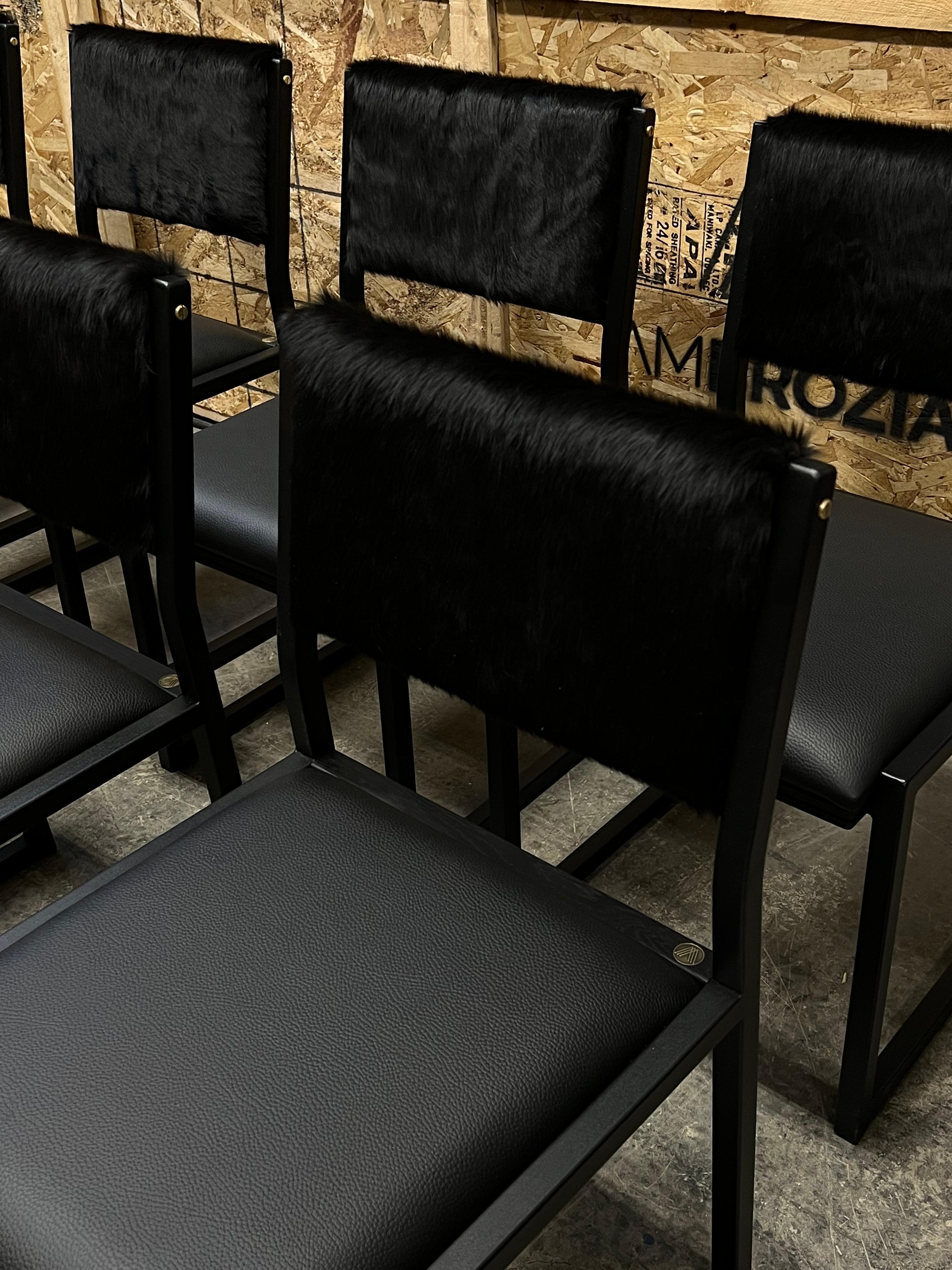 The shaker chair is handcrafted to order from our unique Ambrozia black textured steel tubing frame with a genuine leather seat and Cowhide back. Featuring subtile solid wood insertion that will give a warm and distinguished touch to your space.