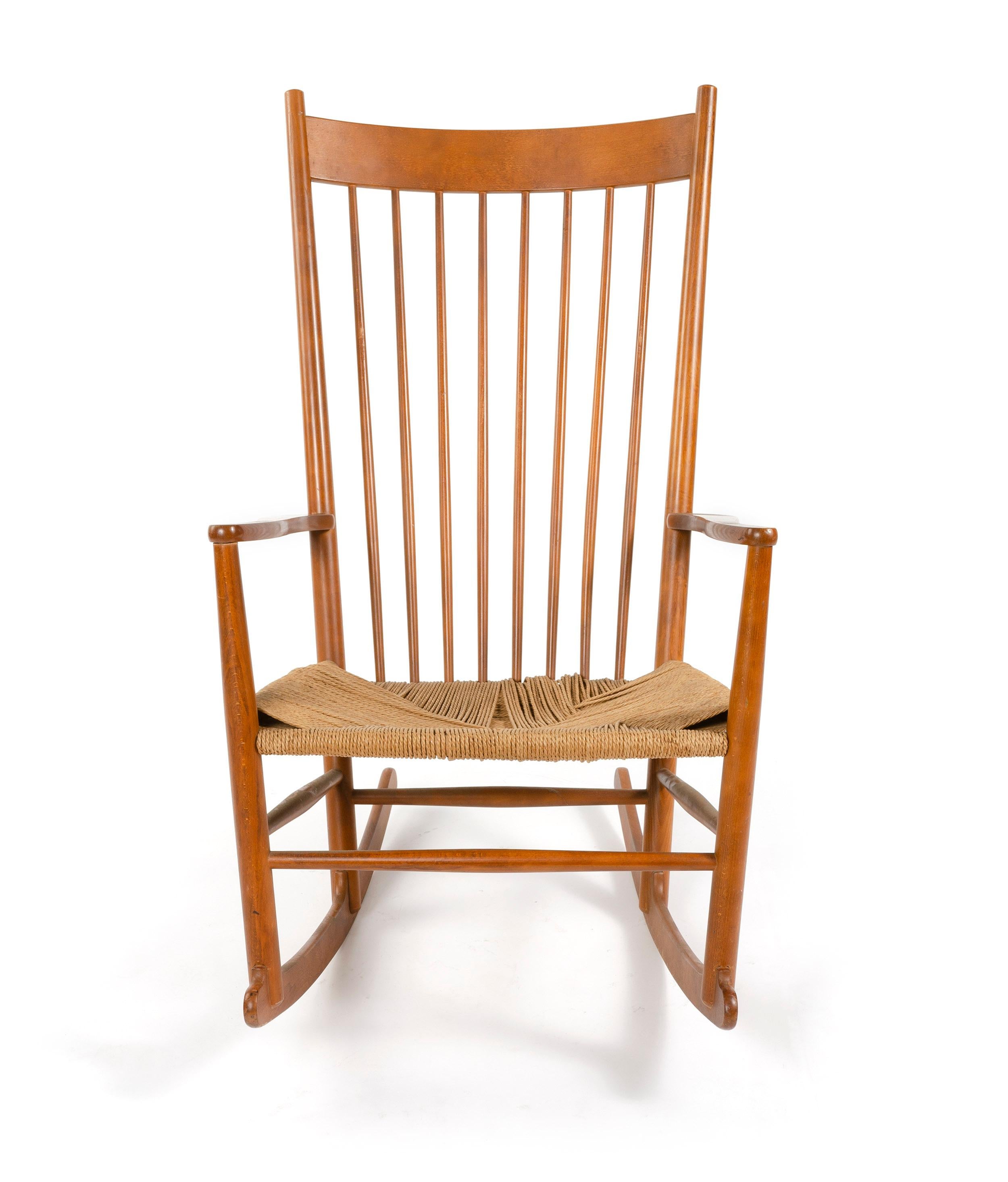 A Shaker Style Scandinavian Modern rocking chair designed by Hans Wegner in beech wood with a woven paper cord seat.
Made in Denmark by FDB, circa 1970s.