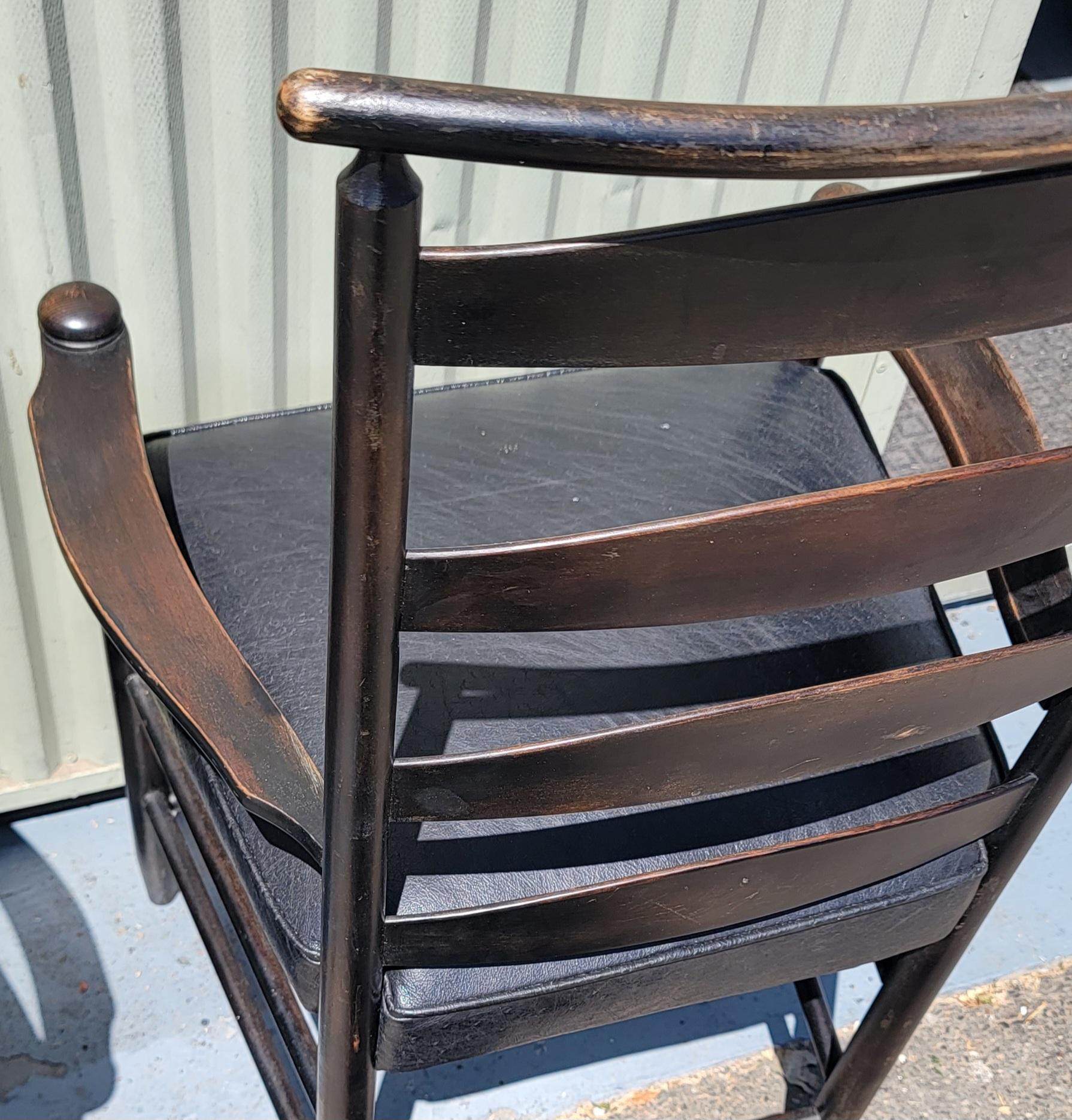 These amazing Shaker style collection of three ladder back chairs are with black leather seats and very comfortable. The chairs are copies from the original Shaker chairs from New England.Two are matching and the third is like a side chair.