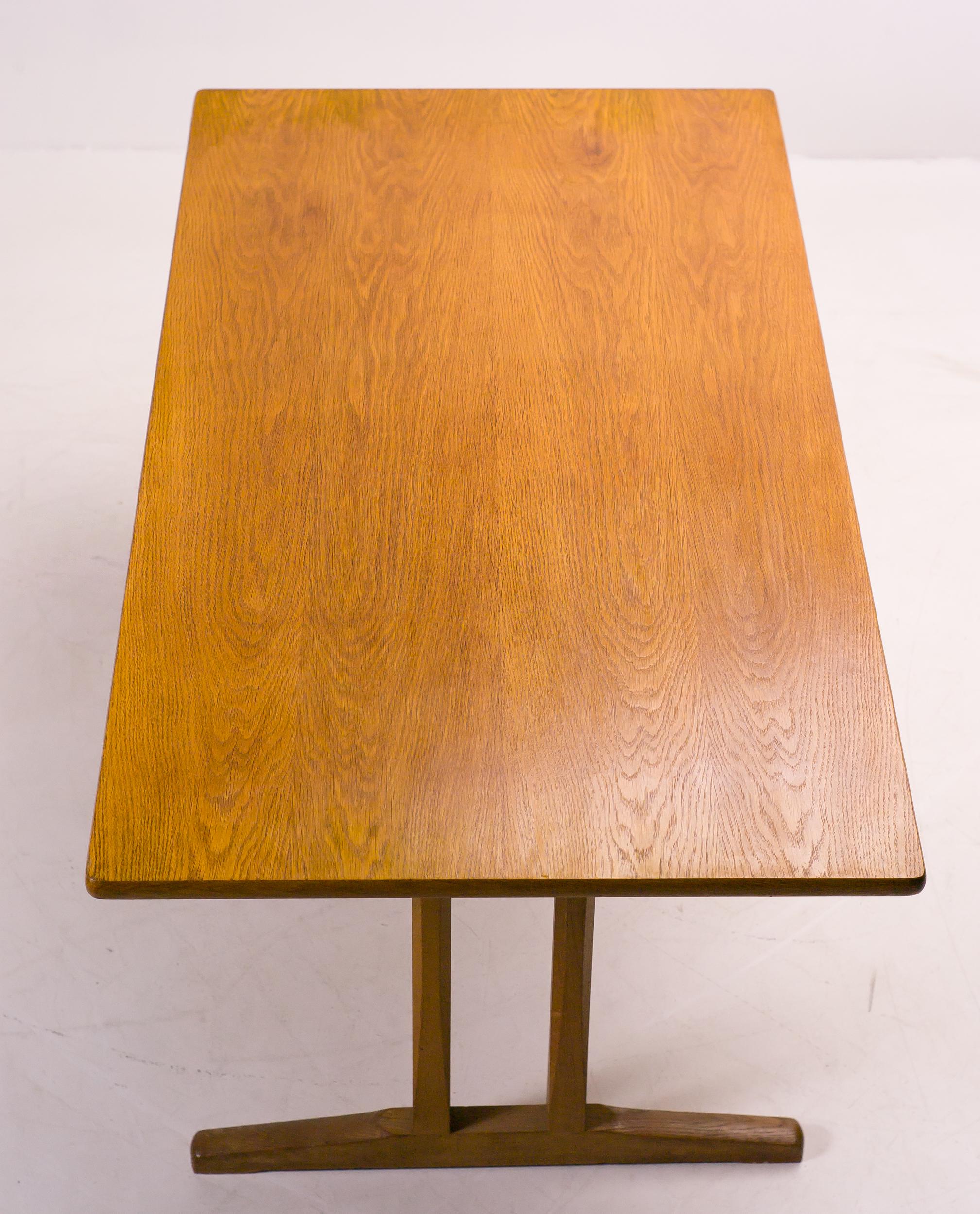 This dining table model C18, inspired by traditional shaker tables, was designed by Børge Mogensen for FDB Møbler, Denmark in 1947.
The trestle legs are inset allowing the person sitting at the table to enjoy a generous amount of leg room. The
