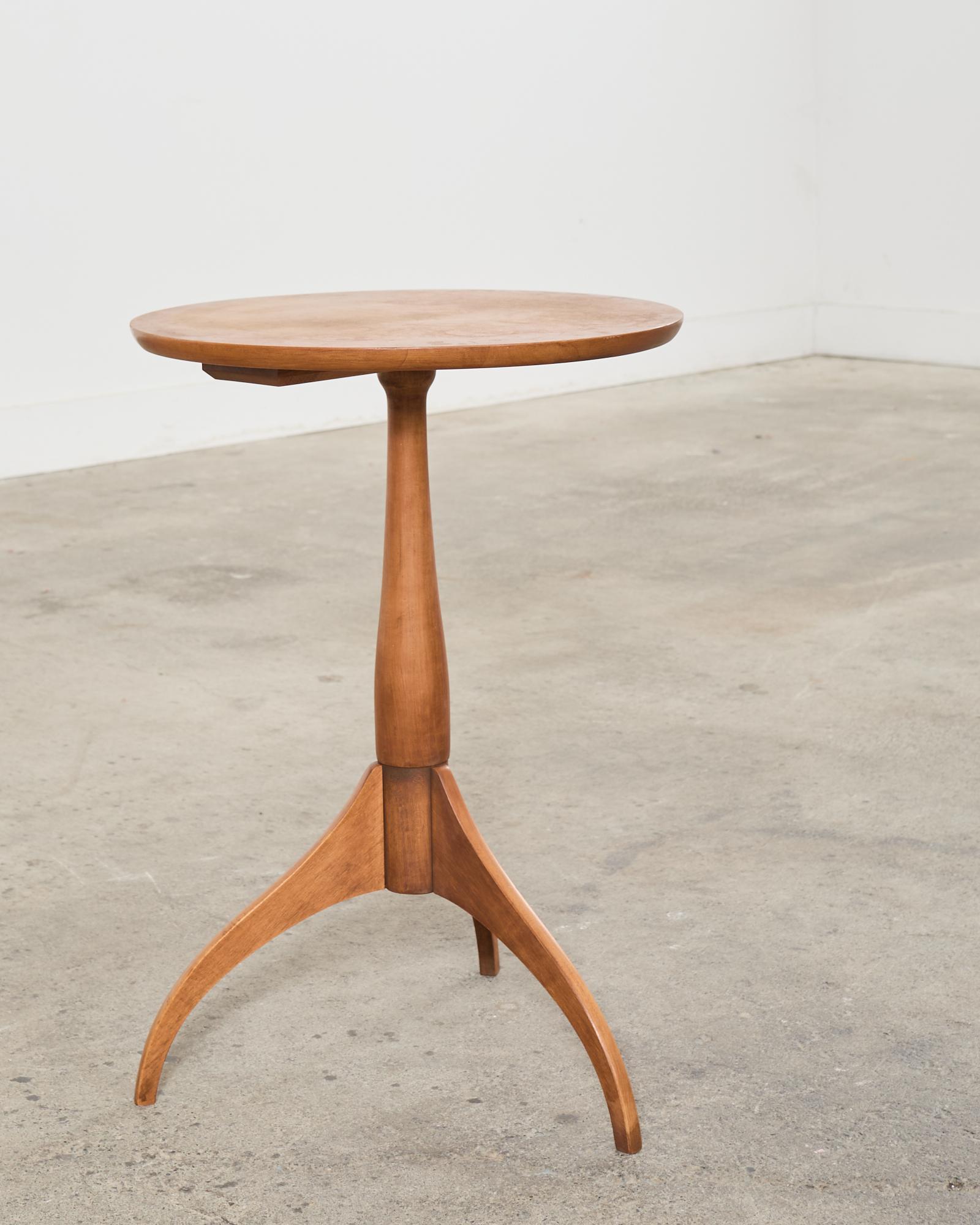 Distinctive pedestal drink table crafted from fruitwood by Shaker Workshops. The table features a round top supported by a tripod pedestal base. The table has a sleek design and vintage faded patina on the finish with excellent joinery and