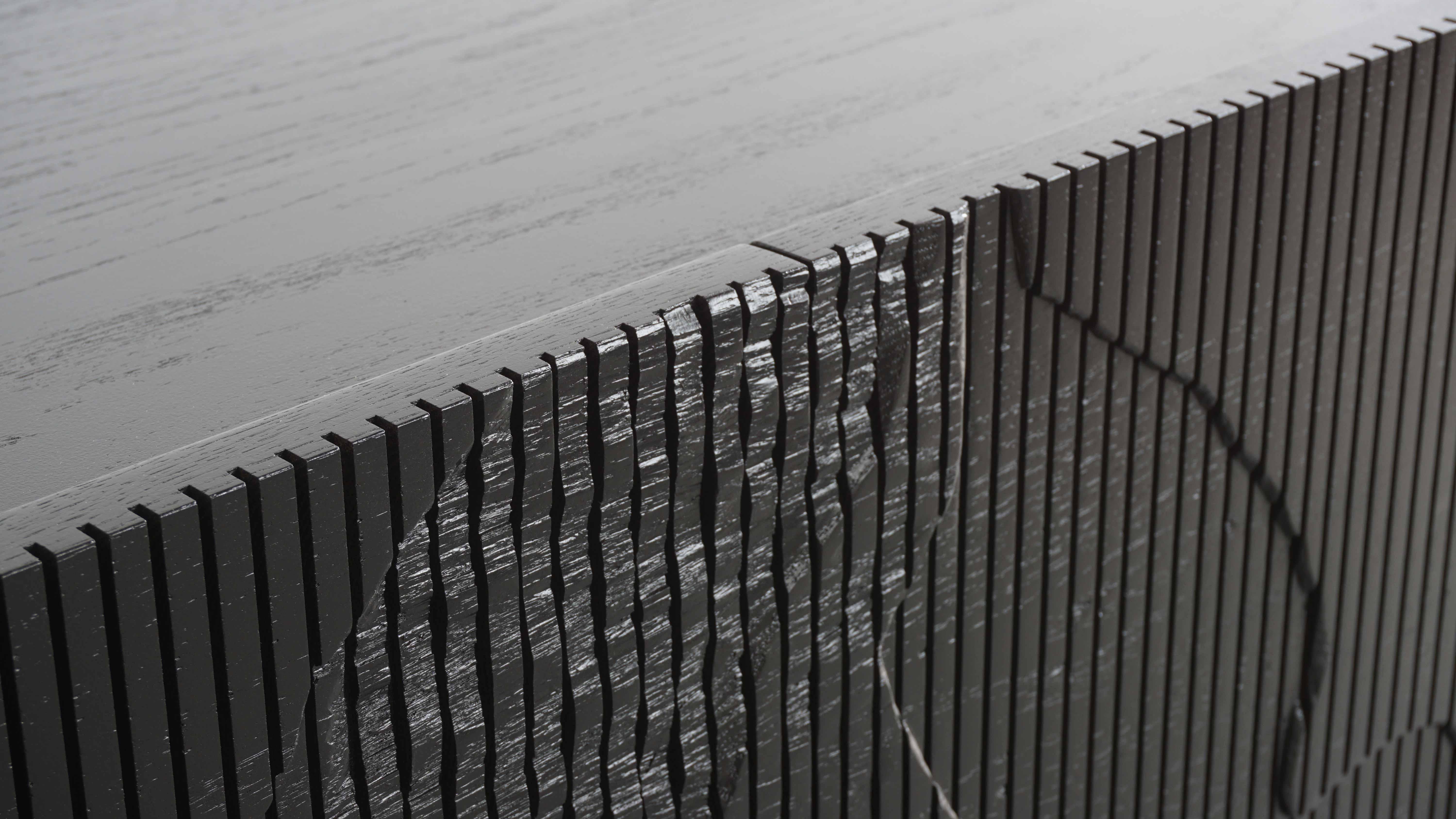 Both monumental and subtle, the Shale Credenza brings the intricacies of nature’s geology indoors. The wood doors are scored vertically across the grain, and details of a cliff’s facade, mapped out by Simon Johns, are carved into them replicating