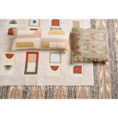 Funda de cojín lumbar tejida a mano con motivos geométricos de pizarra en suaves colores pastel