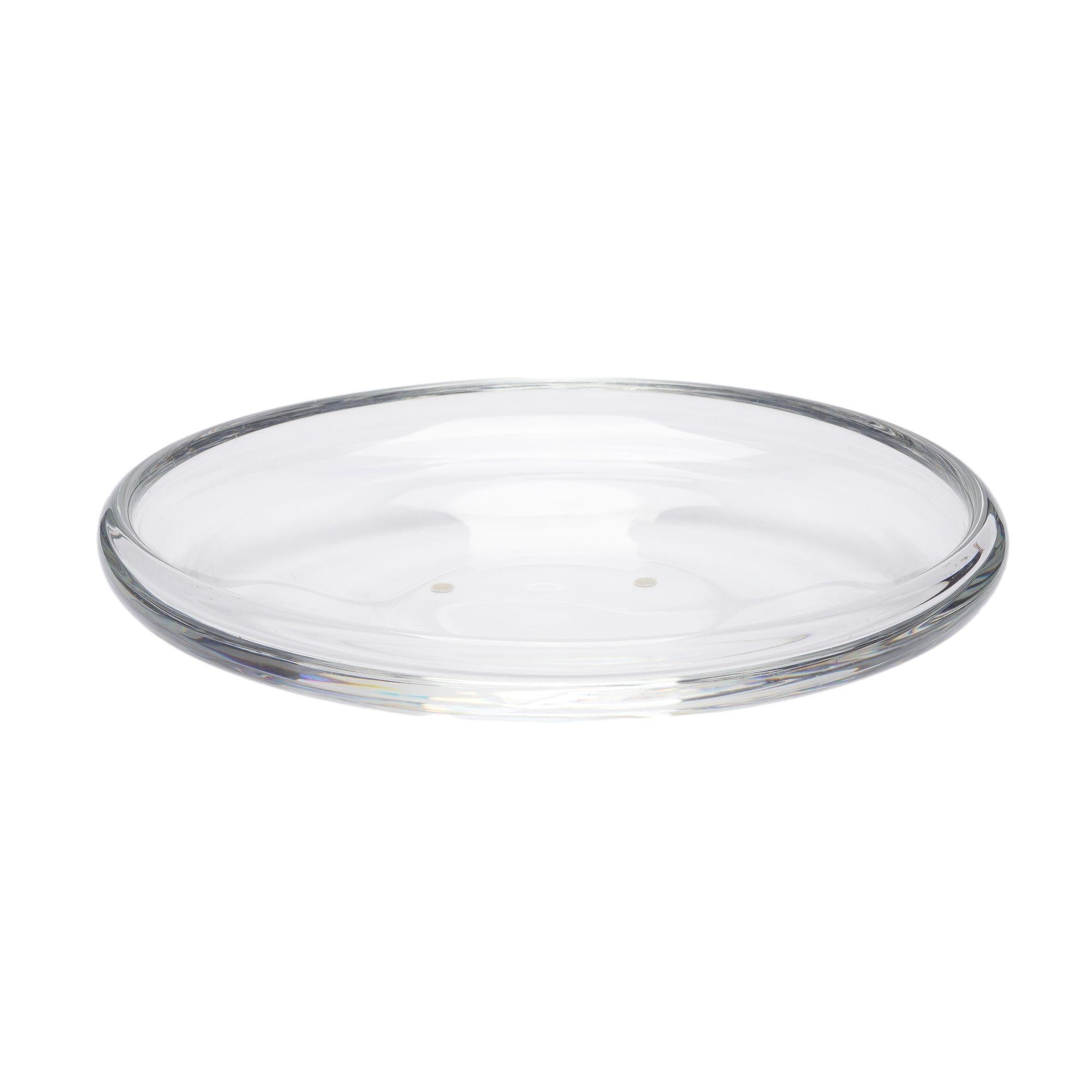 Shallow blown glass center bowl with inverted scroll rim, designed by Walter Heintz for Steuben in 1939.

Signed on the under foot: Stueben

American, 1939.