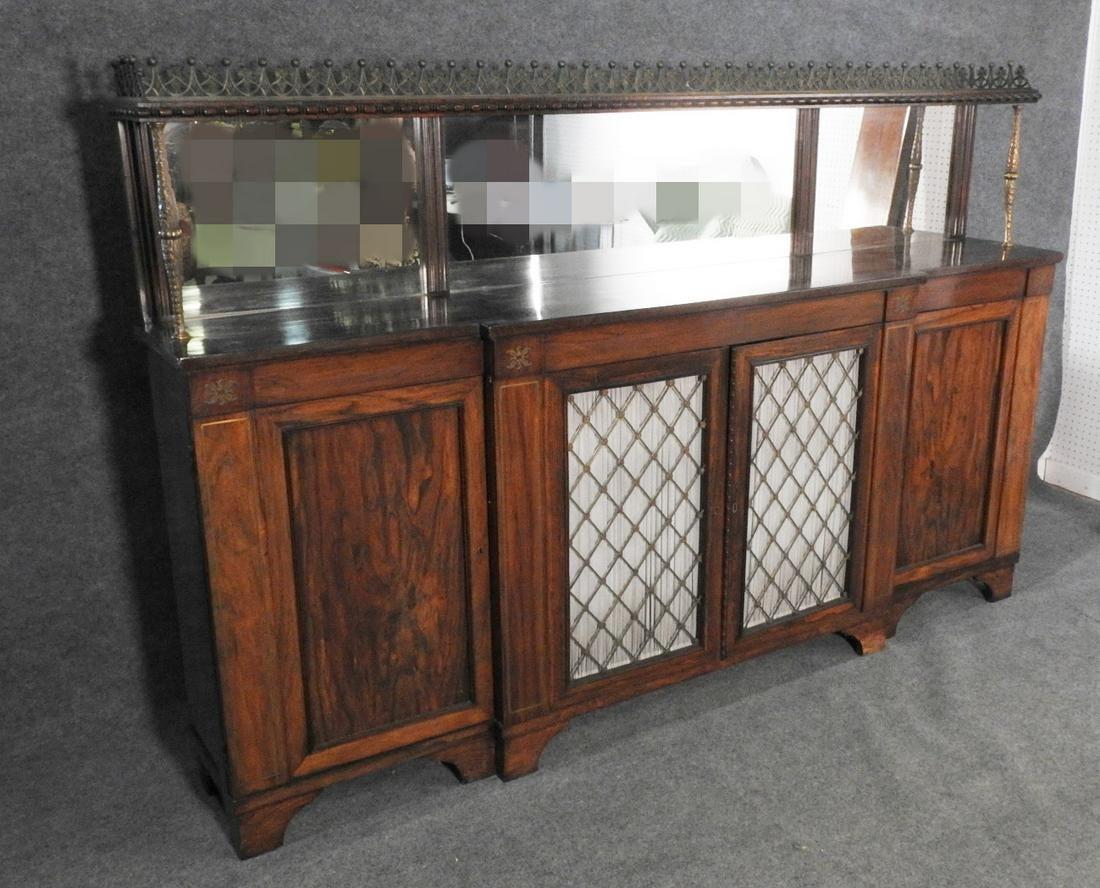 Rosewood with brass gallery. Brass inlay. 4 doors (2 curtained center doors containing 2 shelves). Mirrored backsplash. Measures: 55 3/4