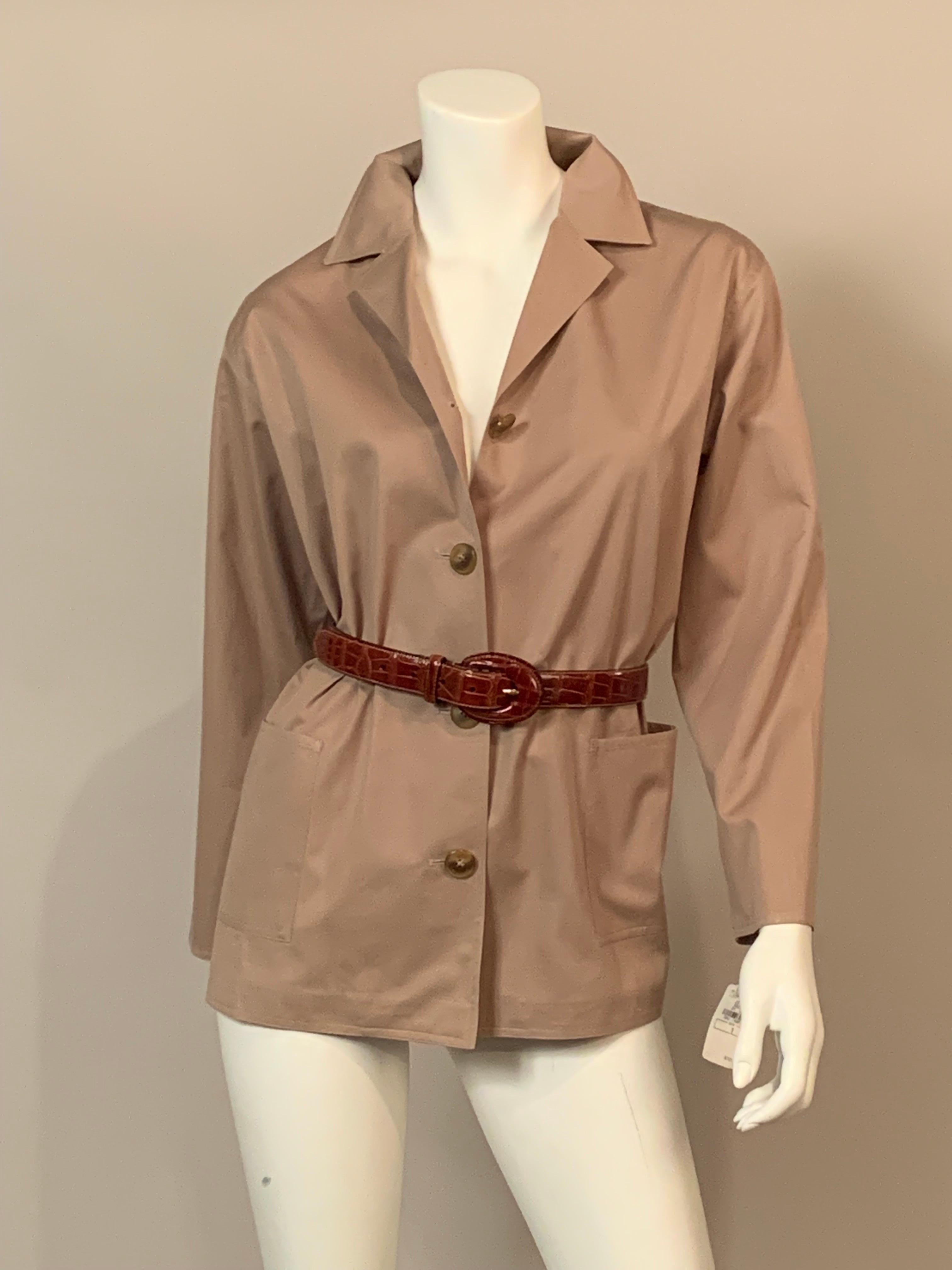 An unlined cotton jacket with a button front and two patch pockets can be worn as a jacket or a loose shirt. Belt it and it becomes a more formal look.  { The American Alligator belt is sold separately }.  The jacket is a size one and it is in