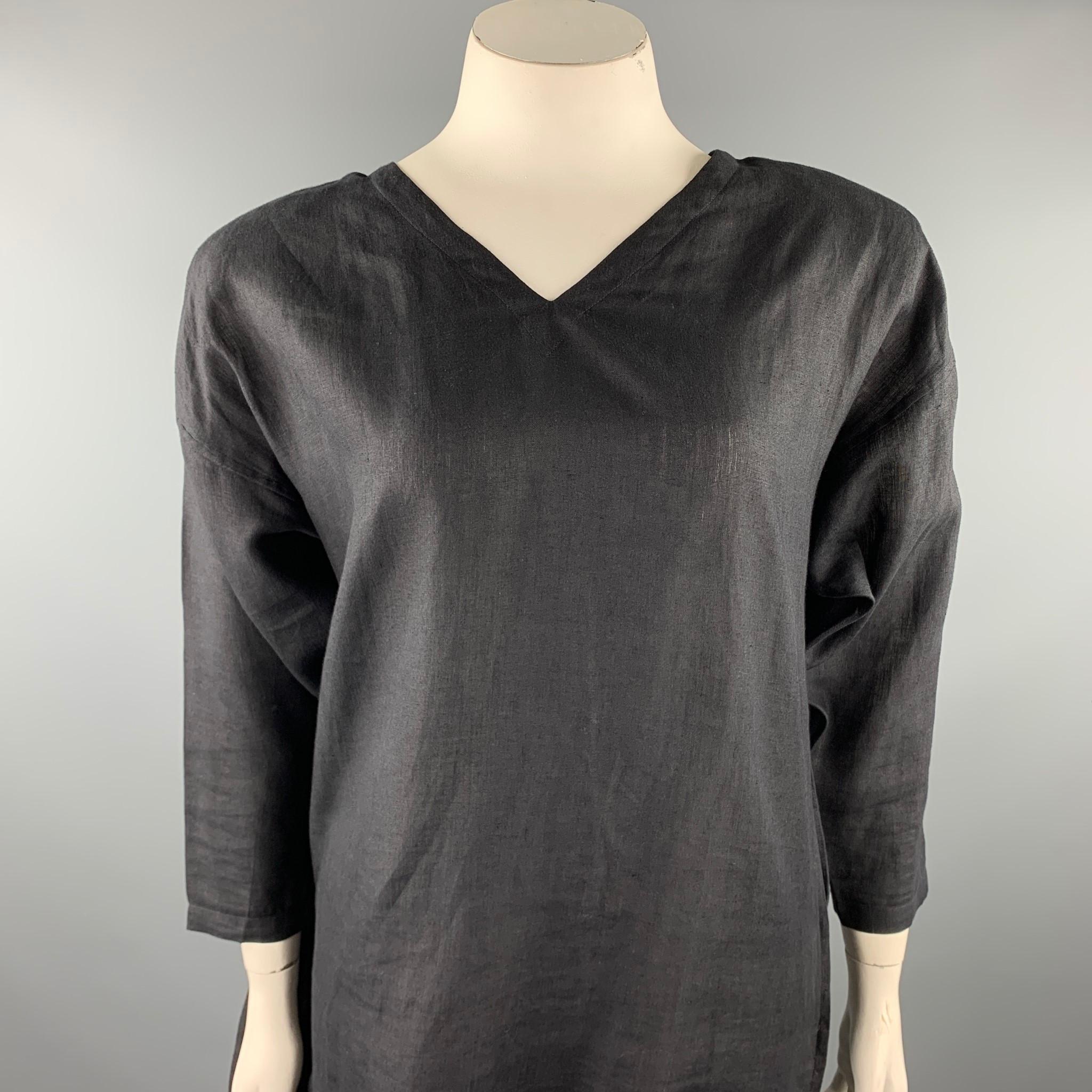 SHAMASK dress comes in a black linen featuring a long front panel design, 3/4 sleeves, shoulder pads, and a back buttoned closure.

Very Good Pre-Owned Condition.
Marked: No size marked 

Measurements:

Shoulder: 23 in. 
Bust: 42 in. 
Waist: 40 in.