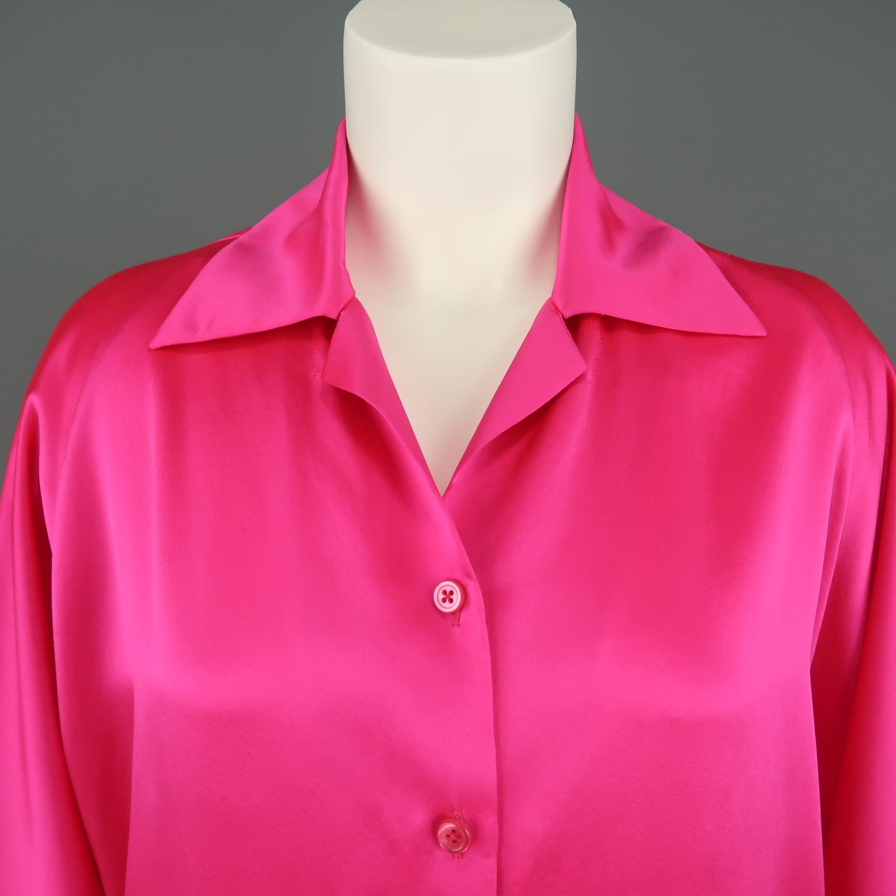 SHAMASK oversized blouse comes in neon fuchsia silk satin with a pointed collar, button up front, and cuffless raglan sleeves.  Wear throughout silk. As-is. Made in USA.
 
Good Pre-Owned Condition.
Marked: 1
 
Measurements:
 
Shoulder: 16 in.
Bust: