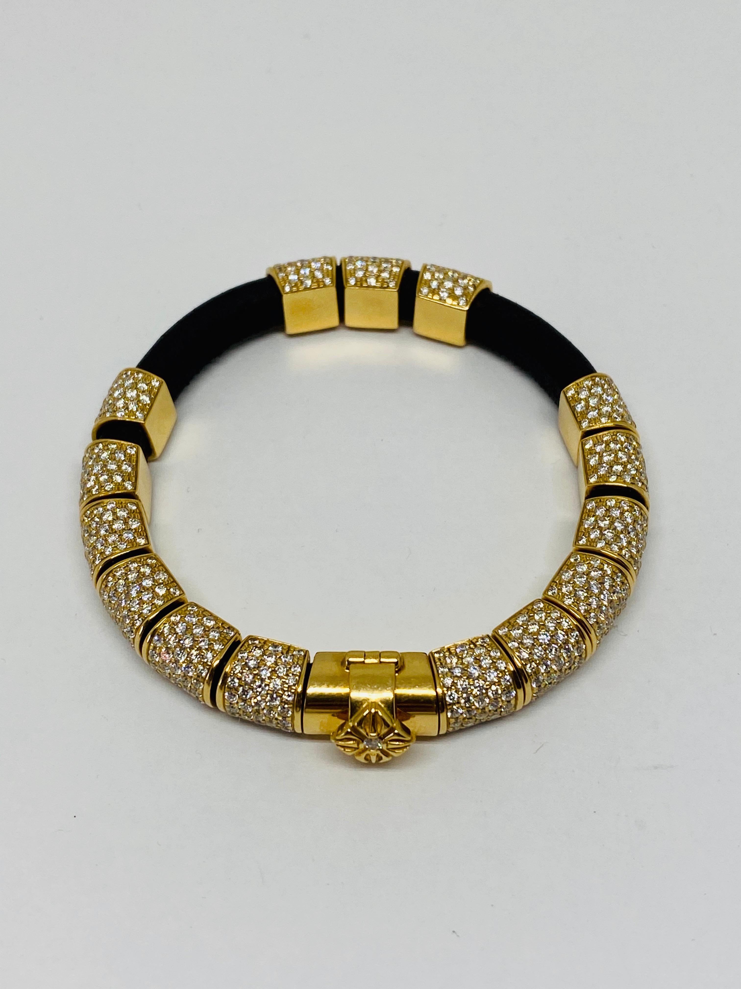 Shamballa 12ct Diamond 18K Yellow Gold and Leather Bracelet 

Product details:
750 18K yellow gold 
Round brilliant cut diamond 12ct
Black leather 
Total weight is 39.2 grams 
Signed Shamballa Jewels SJ, stamped 750K, serial number 1164