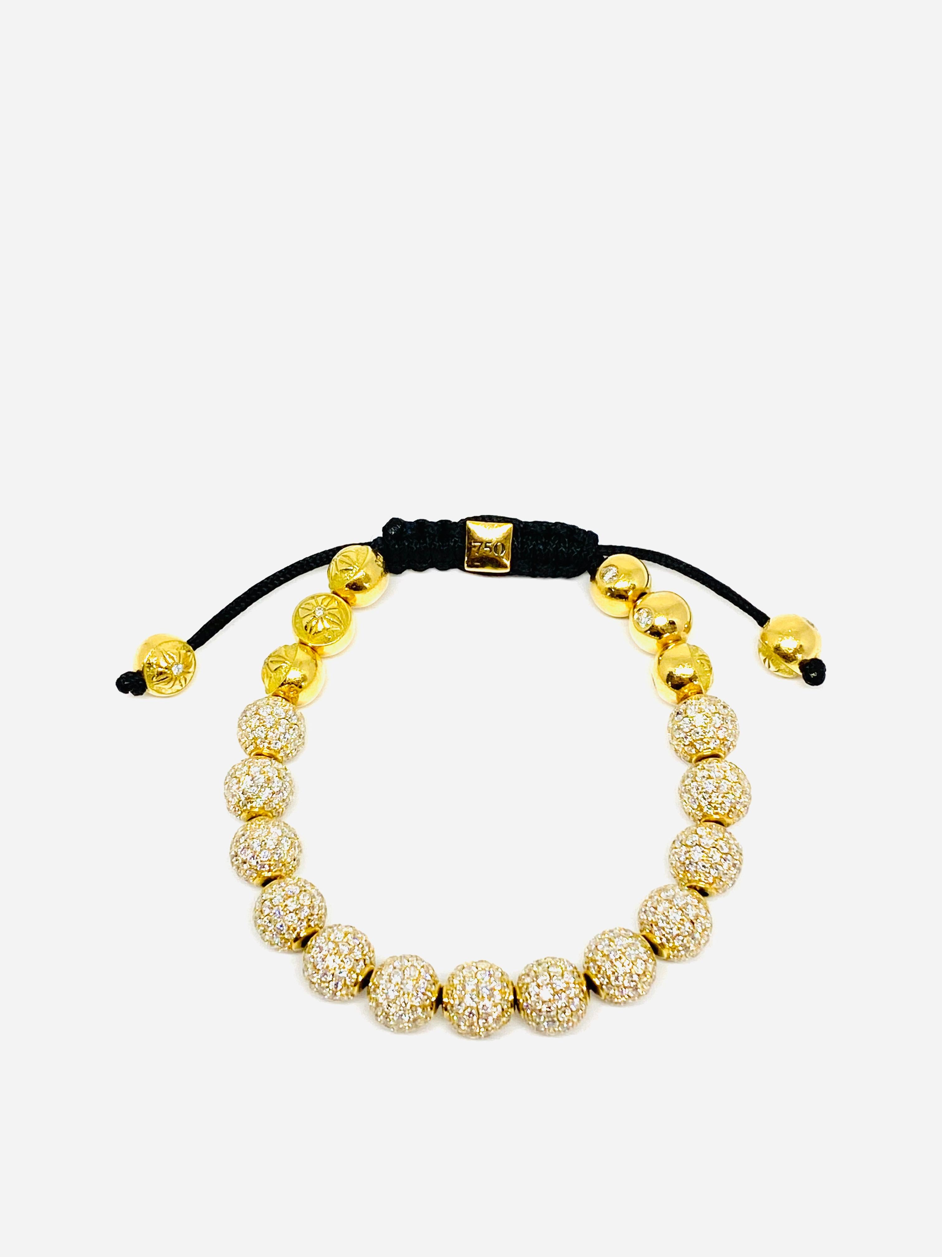 
SHAMBALLA Jewels 6mm Non- Braided 18K Yellow Gold and 9.5 ct Diamond Beads Bracelet

Product details:
All beads are made by hand
Star of Shamballa beads are pave diamond setting (total of 8; 3 on each side and 1 on each end of the bracelet)
Braided