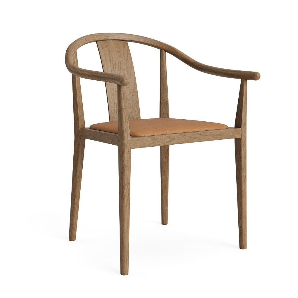 Shanghai Chair by NORR11
Dimensions: D 57,7 x W 58,5 x H 79,5 cm. SH 45. AH: 65 cm.
Materials: Natural ash and upholstery.
Upholstery: Dunes Camel.

Available in different ash finishes: Natural, light smoked, dark smoked, black. Also available in