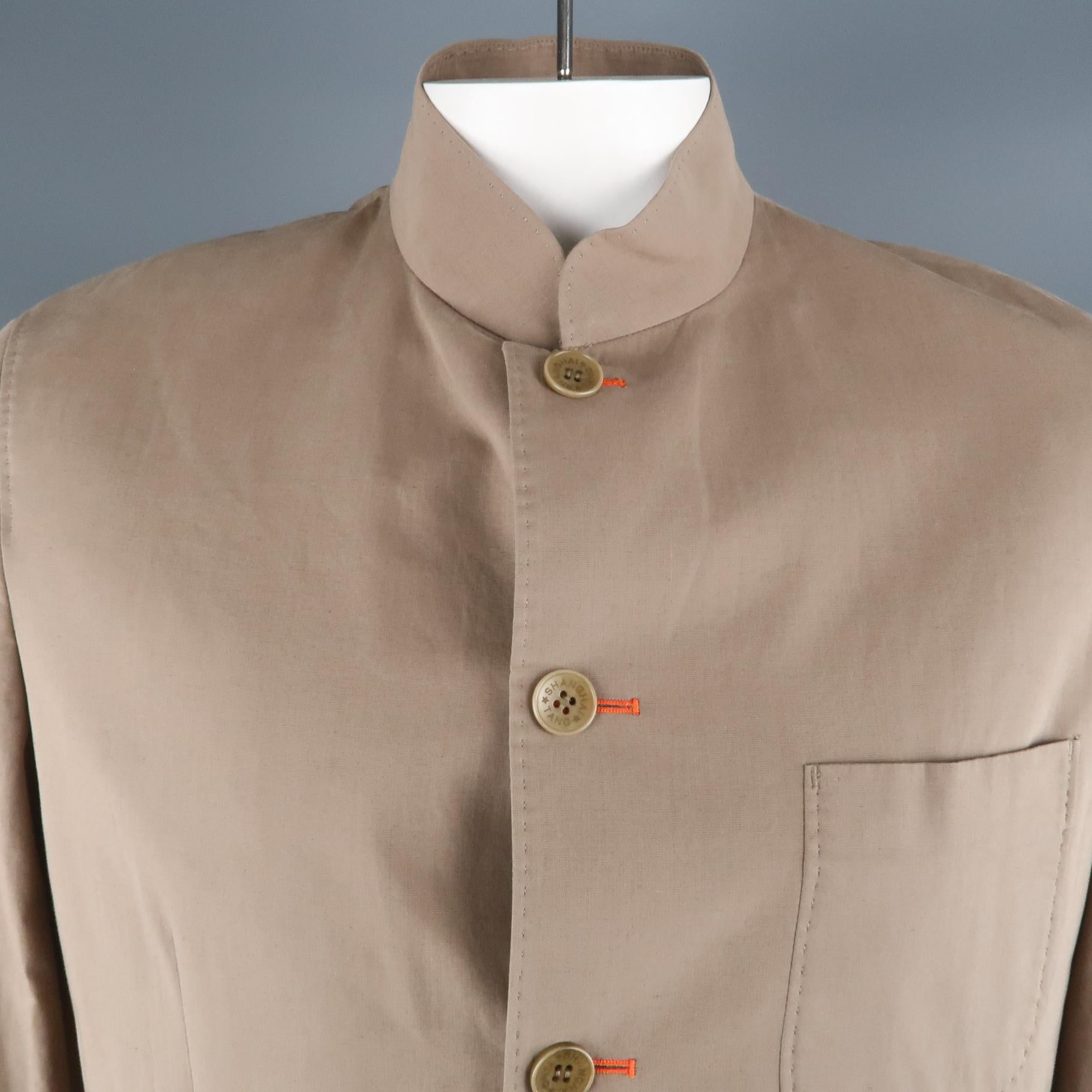 SHANGHAI TANG jacket comes in a khaki cotton featuring a nehru collar, buttoned closure, and flap pockets.
Retailed at $1200

Excellent Pre-Owned Condition.
Marked: 42
 
Measurements:
 
Shoulder: 19.5 in.
Chest: 42 in.
Sleeve: 26 in.
Length: 29.5 in.