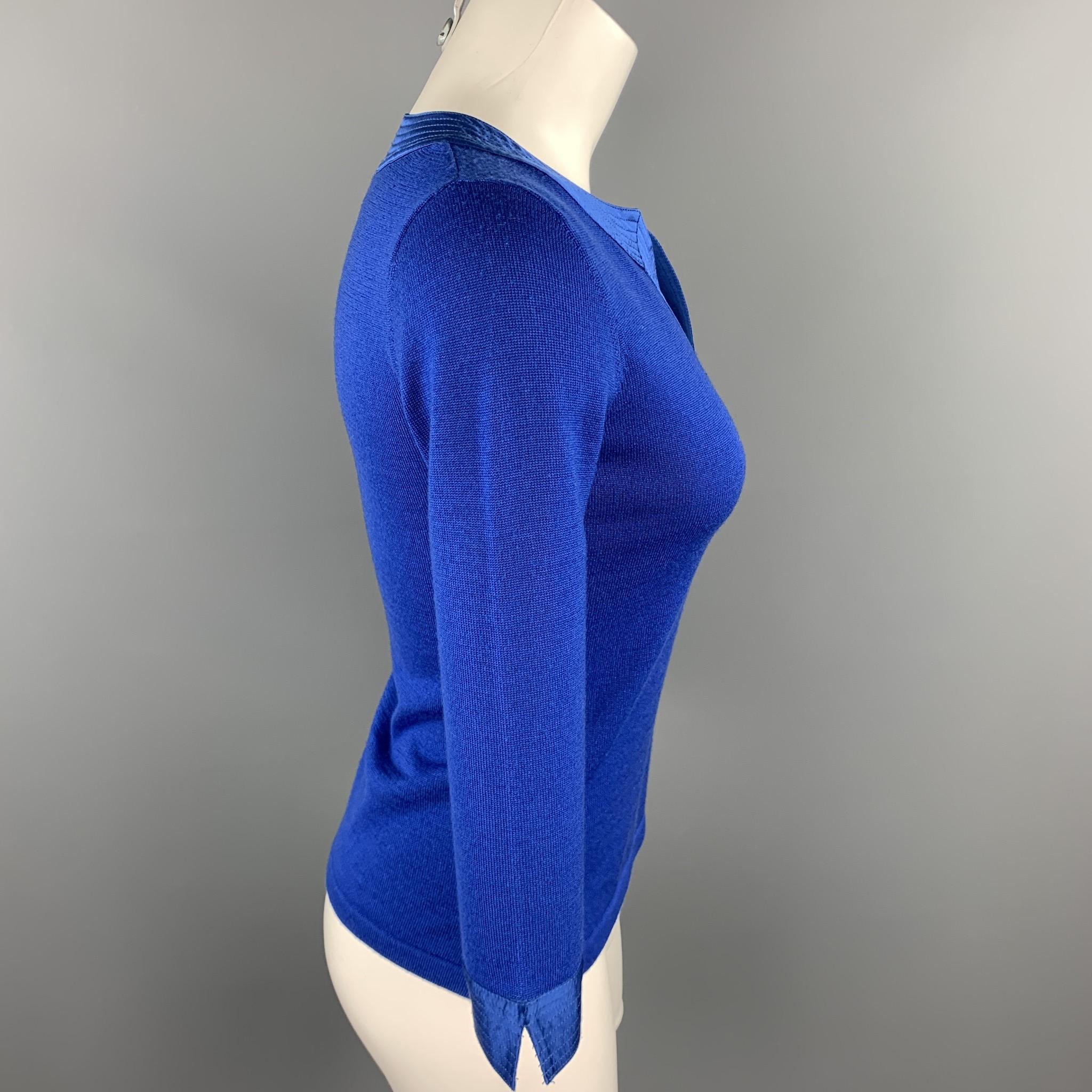 SHANGHAI pullover comes in a blue knitted wool featuring a silk trim and 3/4 sleeves. 

Excellent Pre-Owned Condition.
Marked: S

Measurements:

Shoulder: 14.5 in. 
Bust: 32 in. 
Sleeve: 18.5 in. 
Length: 19.5 in. 

SKU: 89082
Category: