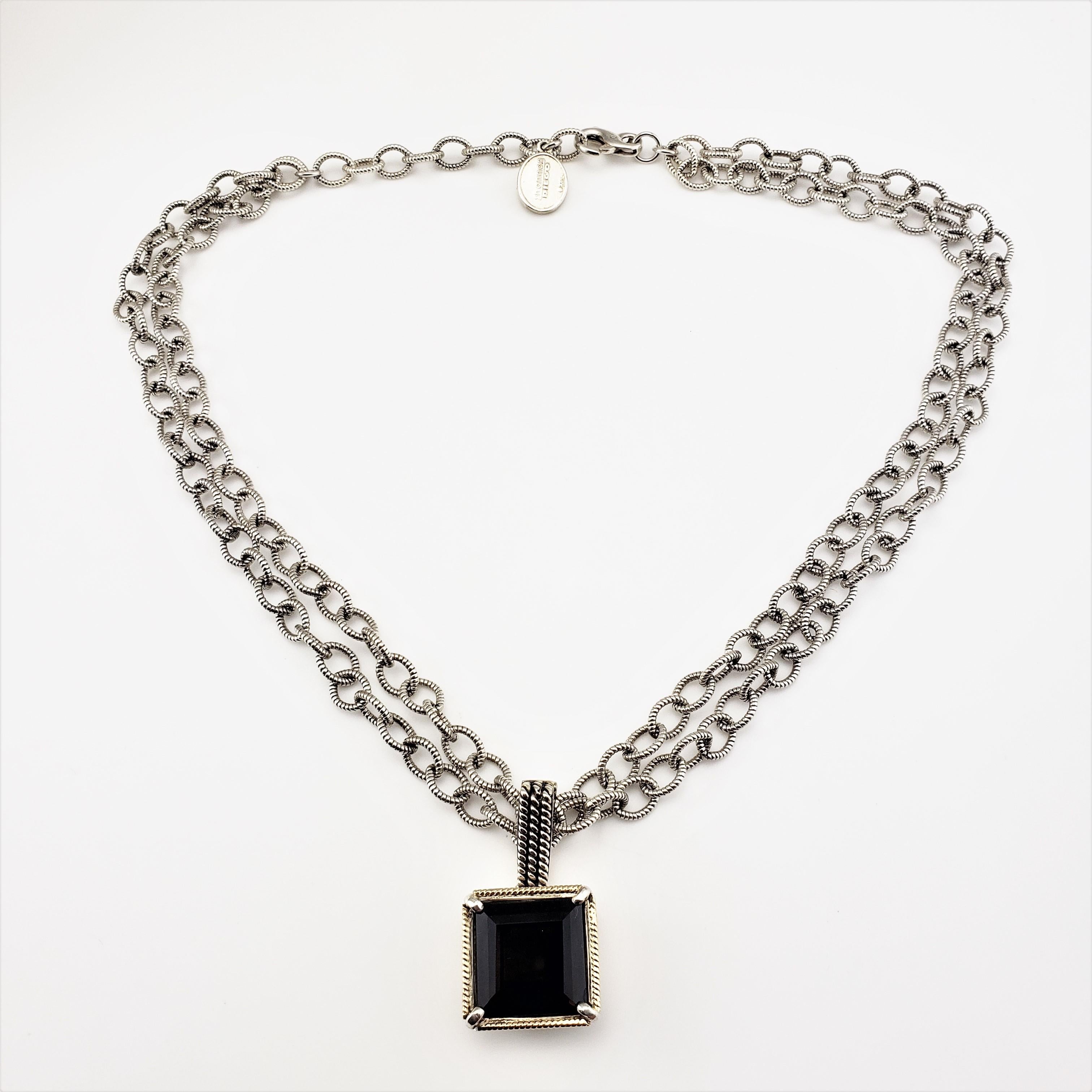 Shannon Diego 2001 Sterling Silver 14 Karat Yellow Gold Smokey Topaz Enhancer Link Necklace-

This lovely sterling silver double chain necklace features one square smokey topaz (16 mm x 16 mm) framed in 14K yellow gold.  Lobster claw closure.

Size: