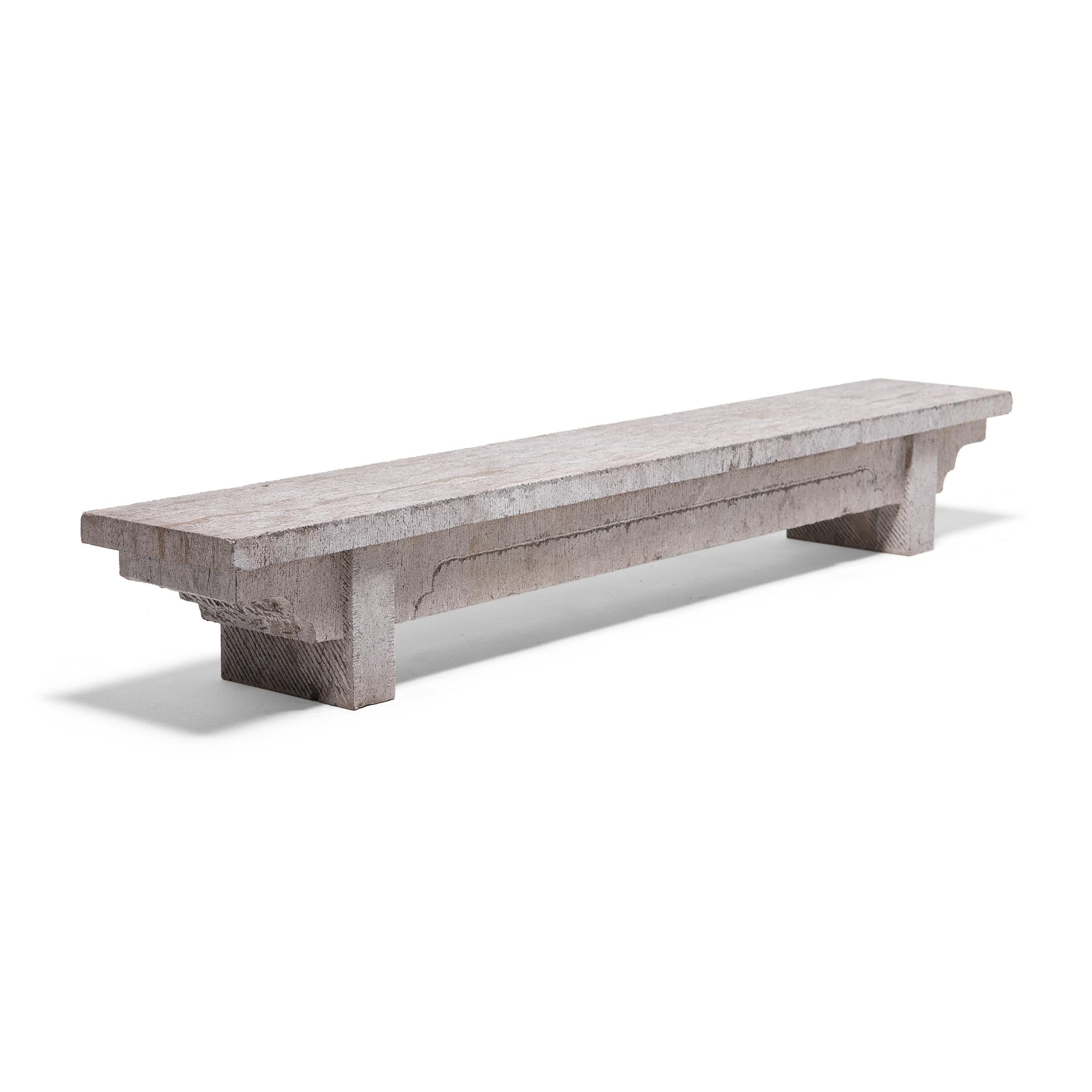This simply designed doon bench from China's Shanxi province is carved by hand from a single block of limestone. With a strong, low profile and subtle stepped spandrels, the bench honors the balanced proportions and minimal forms characteristic of