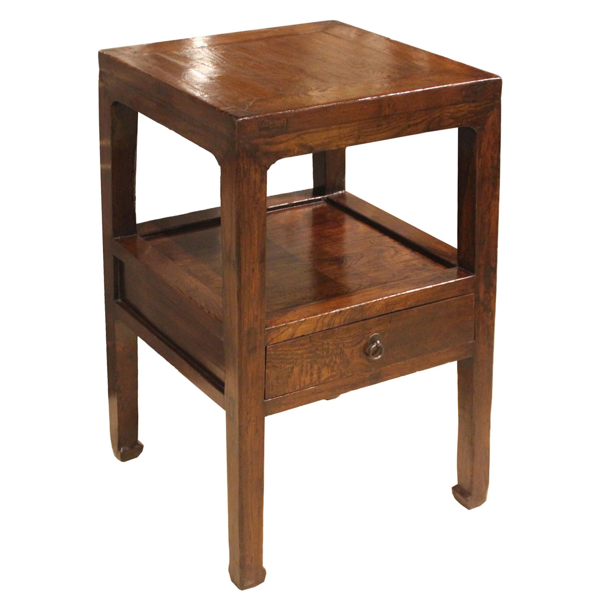 Unusual vintage side table from Shanxi, China with beautiful elm grain, shelf, drawer, and horse hoof-style feet. Perfect between two lounge chairs or next to a bed. New hardware.