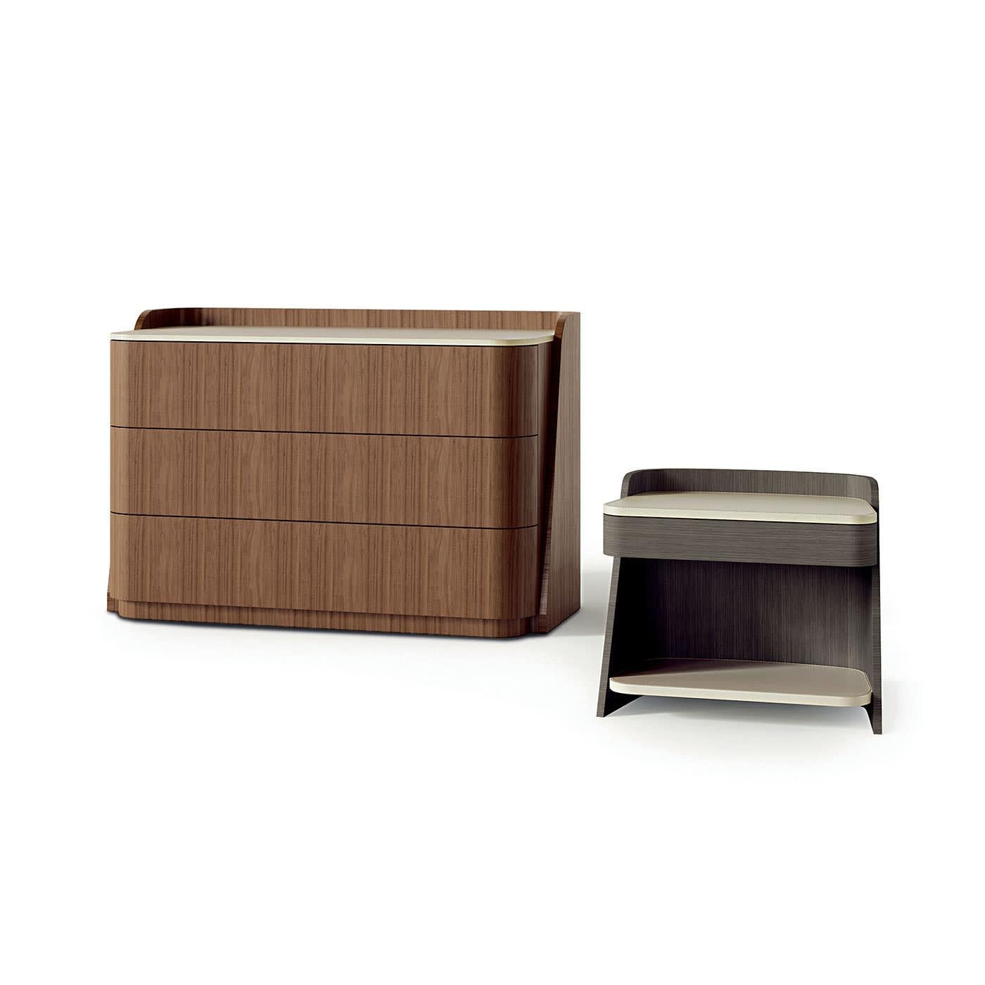 Chest of drawers from the Shape line covered in Canaletto Walnut. Equipped with three large push and pull drawers and slow motion system with a leather interior. Top covered in leather.