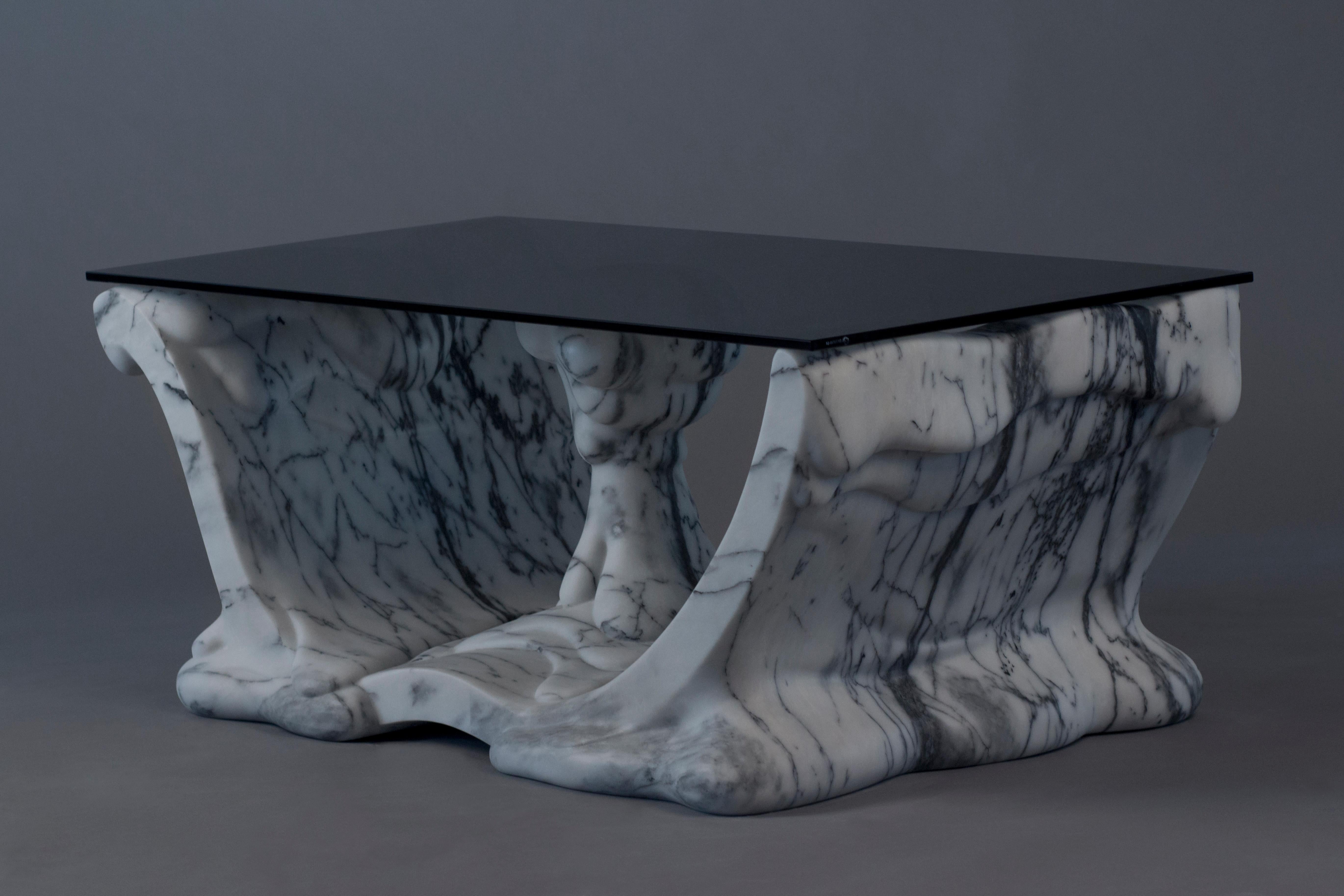 Shape Coffee Table in Marble & Tempered Glass by MANTA Handmade Stone Design
Limited Edition of 5 Pieces.
Dimensions: D 60 x W 119 x H 42,5 cm. 
Materials: Pele de Tigre marble and tempered gray glass.
Weight: 150 kg.

MANTA is the design brand of