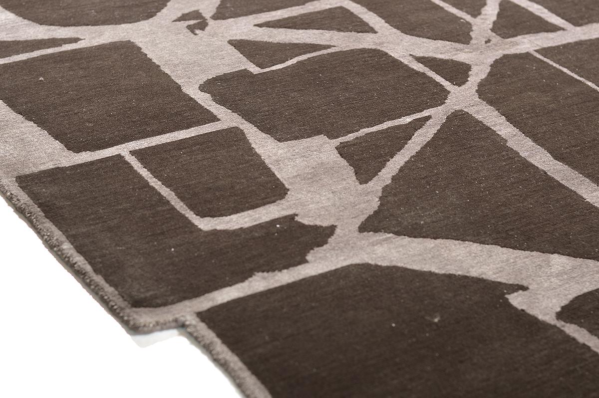 Rich brown wool base hand knotted with light silk abstract details. Shape Idex has irregular edges and intricate design elements.





Rug Number 27899
Size 8' 9