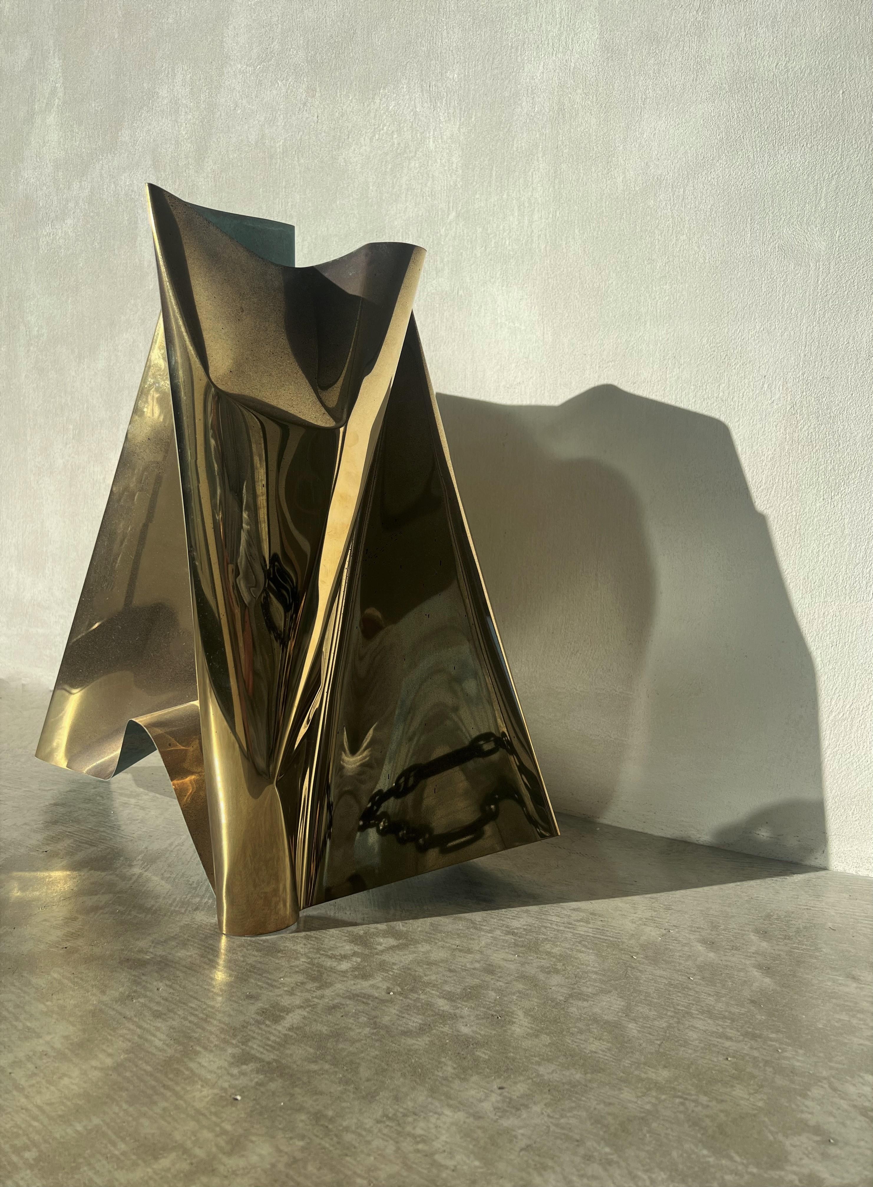 Shape Shifter II 2023 by Jodi Newnham. Bright folded brass with aged patina on the exterior and green patina underside. Sculptural metal wall art by New Zealand artist Jodi Newnham. Owner, collector and designer at midcentury Swag, Swag Design