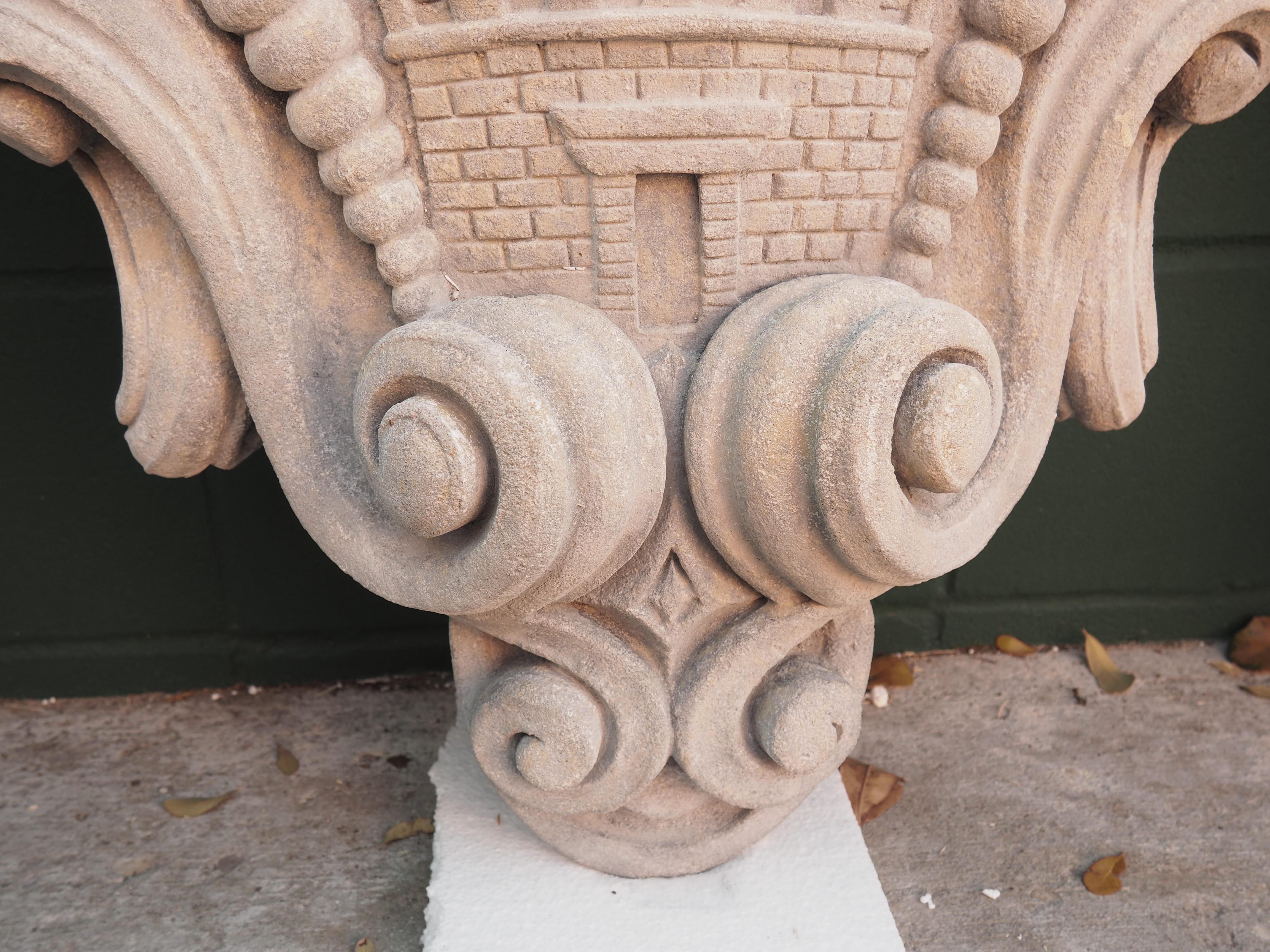 This shaped limestone cartouche plaque was hand-carved in Italy. The side scrolls and volutes are large and shapely, while the center shield is carved in bas relief. The bas-relief (sometimes called “low relief”) technique, elements are carved with