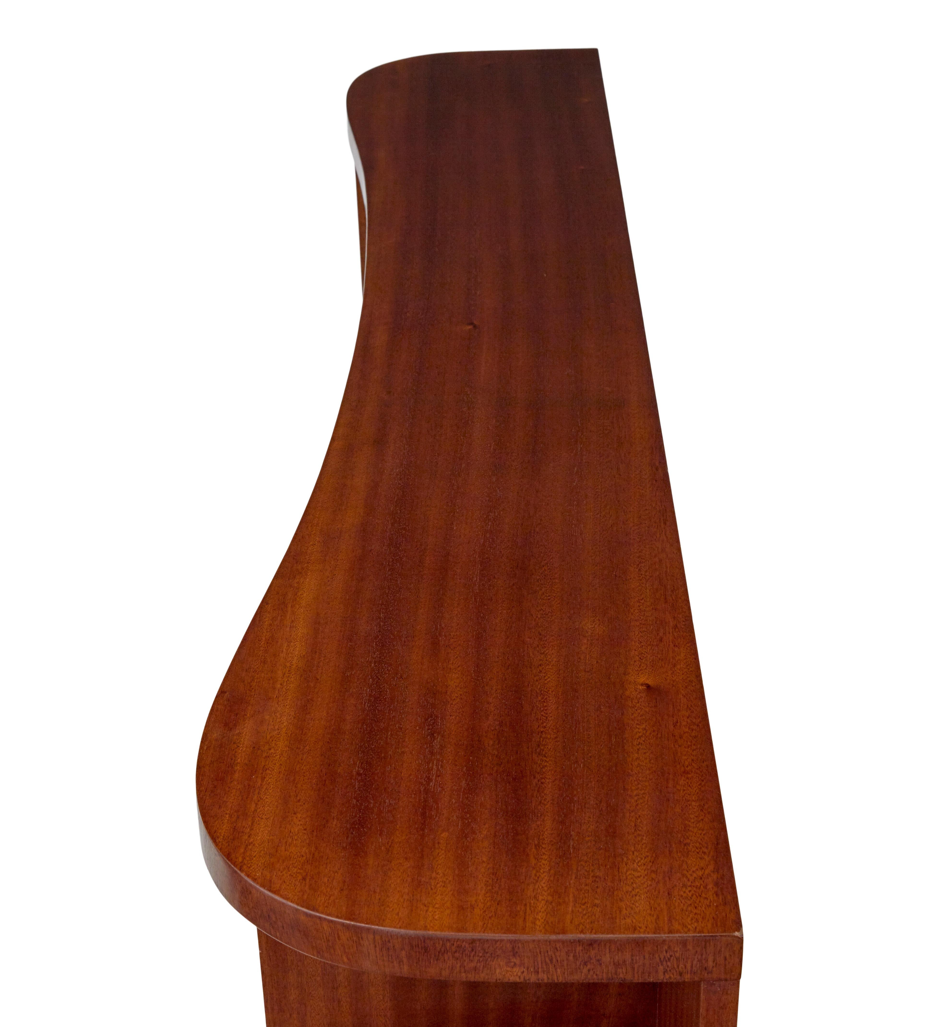 20th Century Shaped mid century Scandinavian mahogany low open bookcase