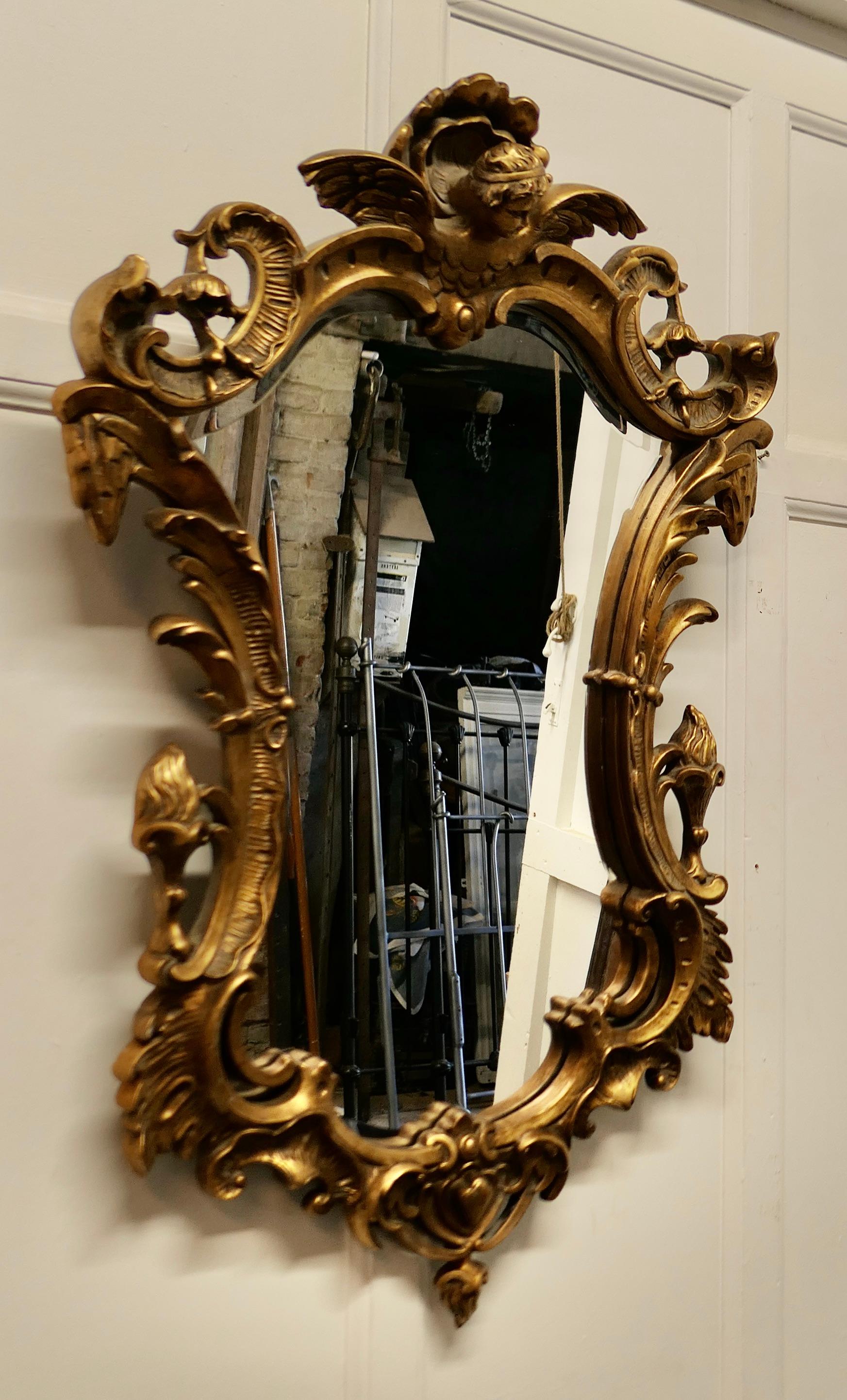 Rococo Revival Shaped Rococo Style Gilt Wall Mirror For Sale