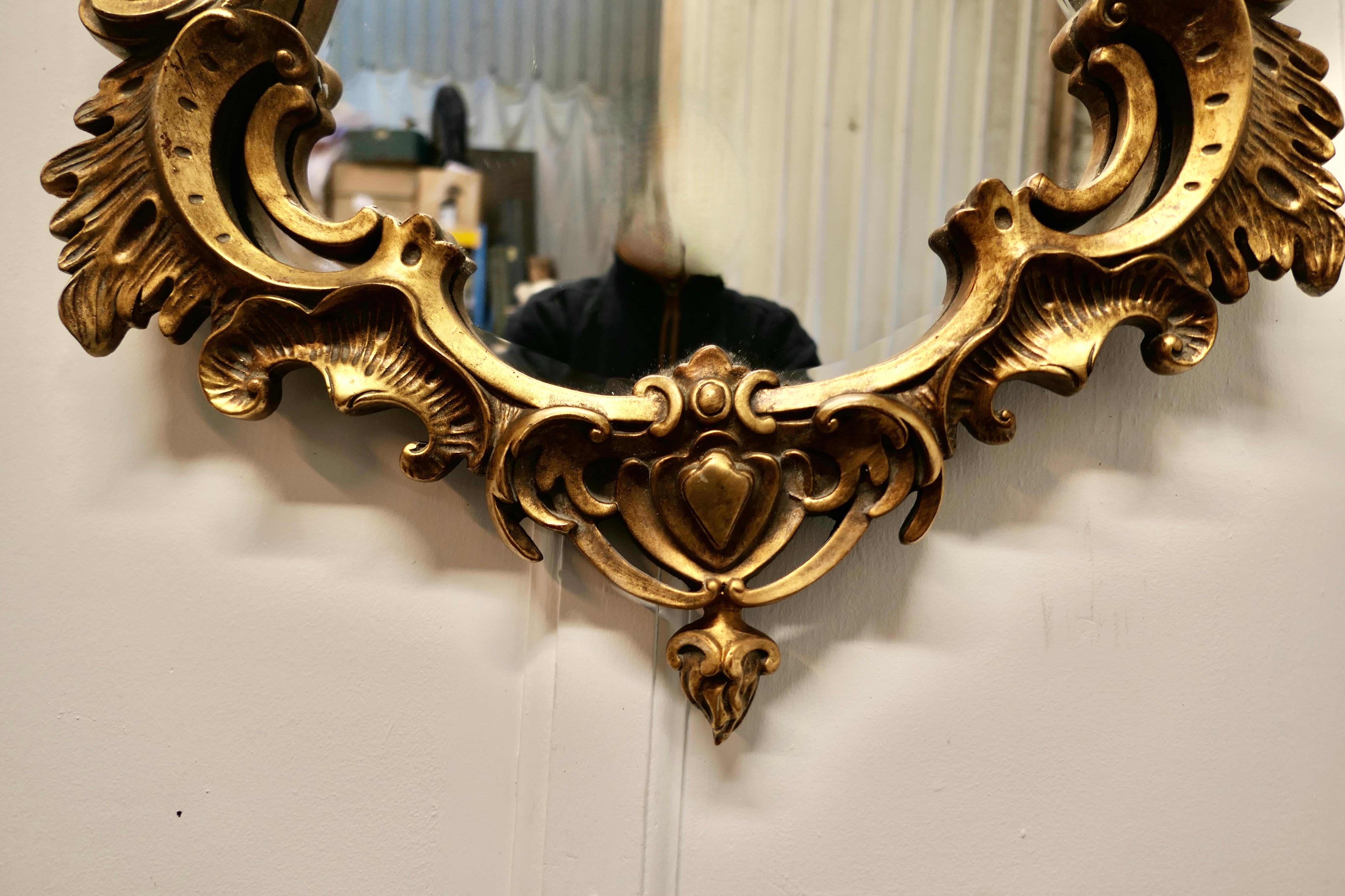 Late 20th Century Shaped Rococo Style Gilt Wall Mirror For Sale