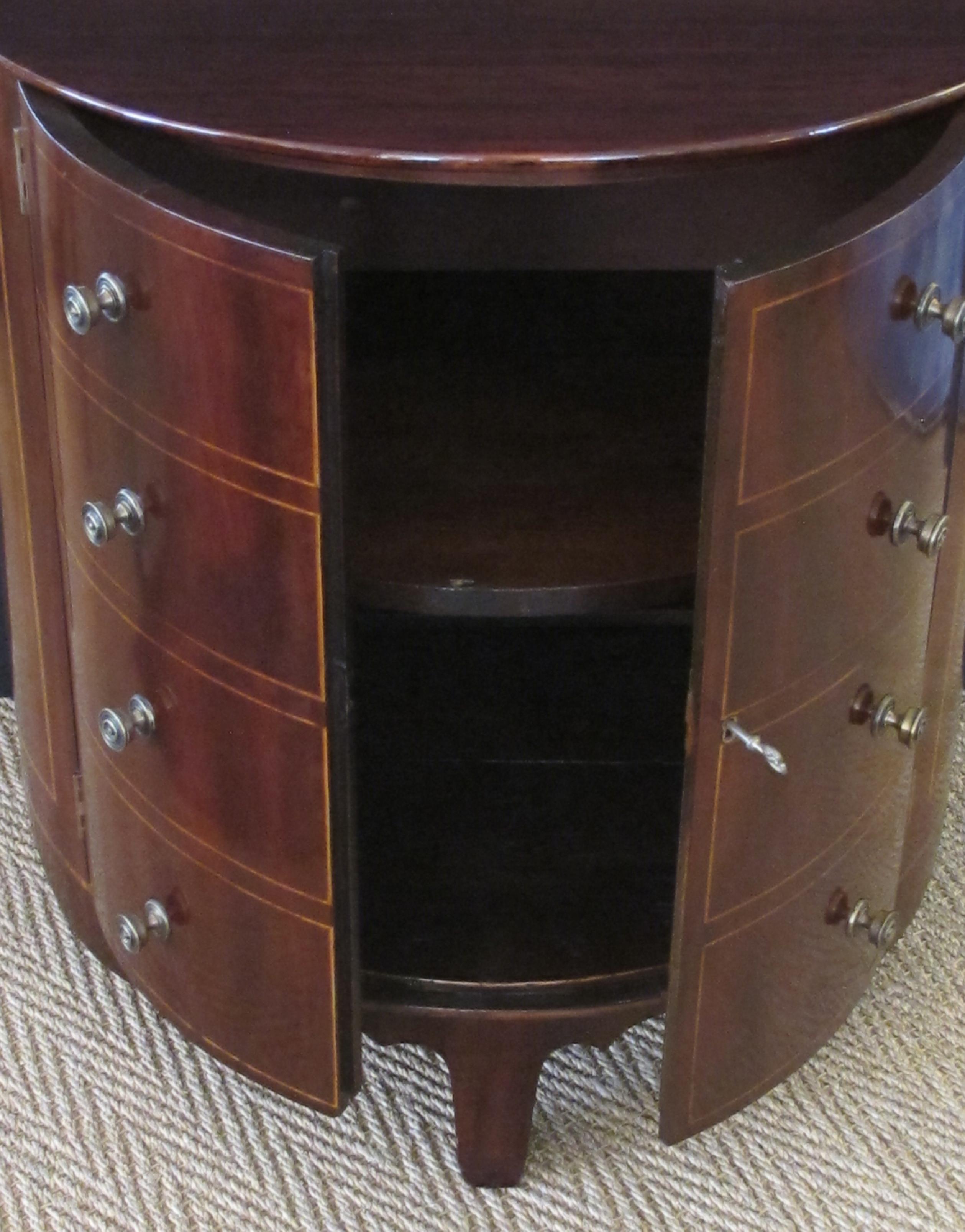 Shapely and Elegant English Regency Mahogany Two-Door Demilune Chest/Cabinet In Excellent Condition In San Francisco, CA