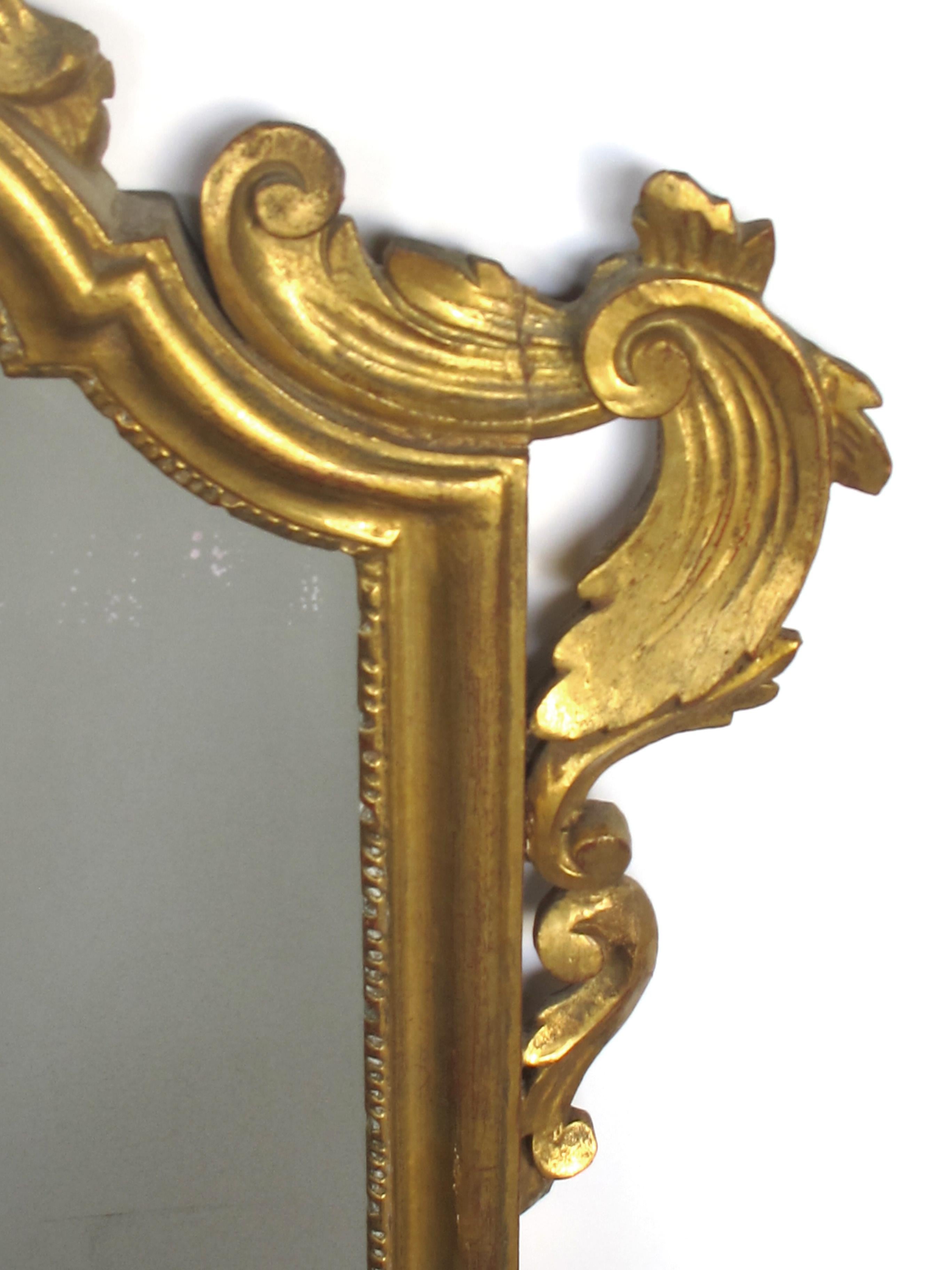 Shapely Italian Rococo Style Carved Giltwood Mirror with Openwork Rocaille Crest In Good Condition For Sale In San Francisco, CA