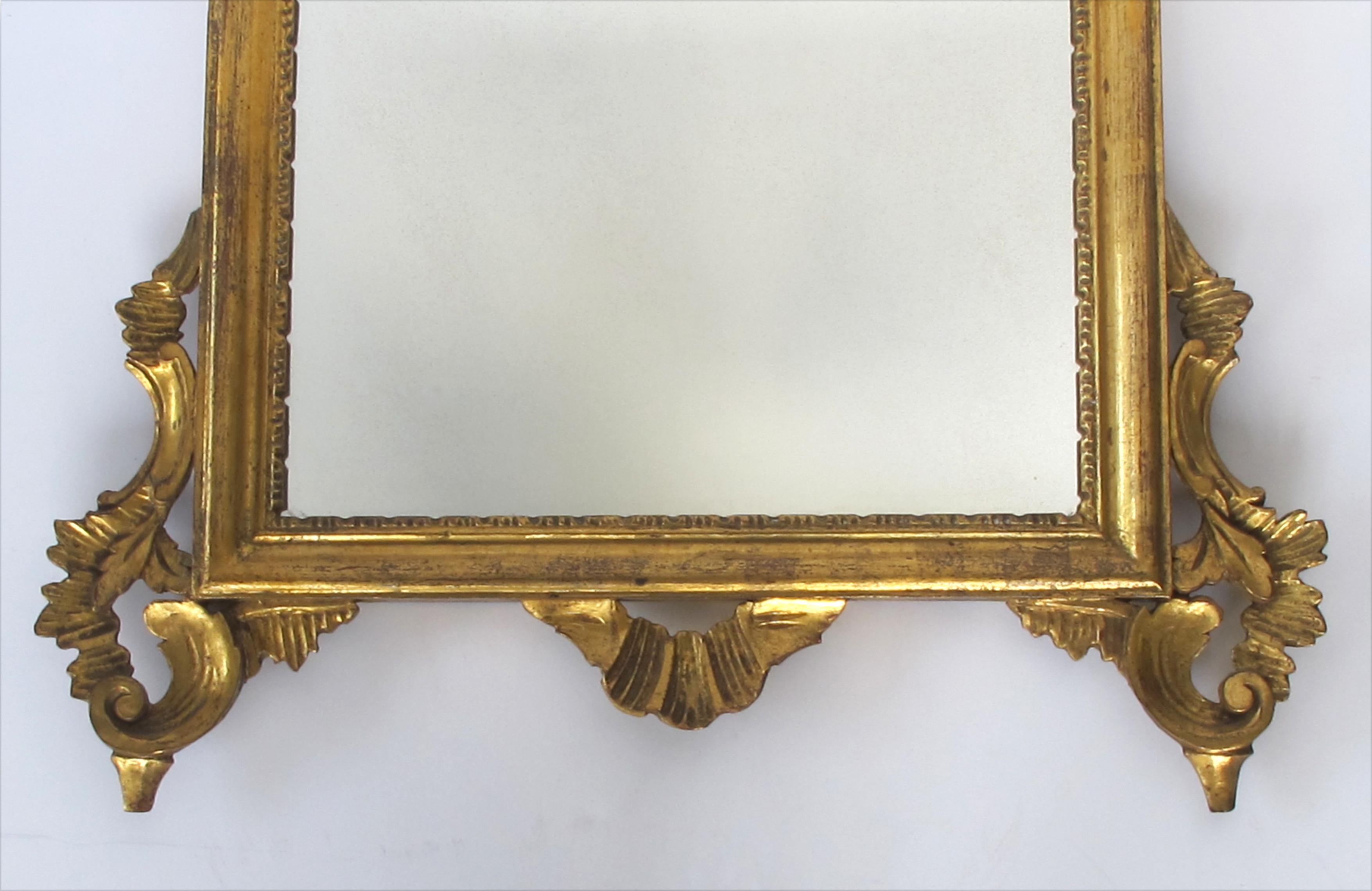 Early 20th Century Shapely Italian Rococo Style Carved Giltwood Mirror with Openwork Rocaille Crest For Sale