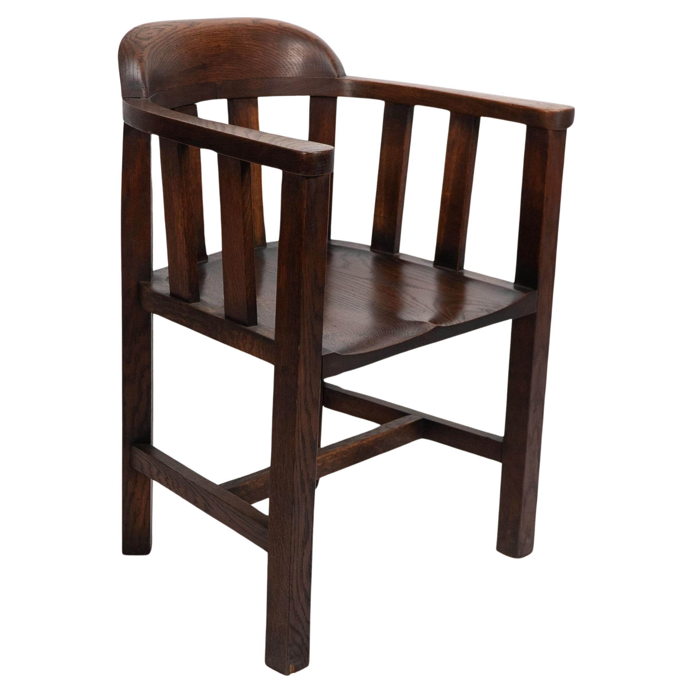 Shapland and Petter. A long run of Arts and Crafts oak tub chairs