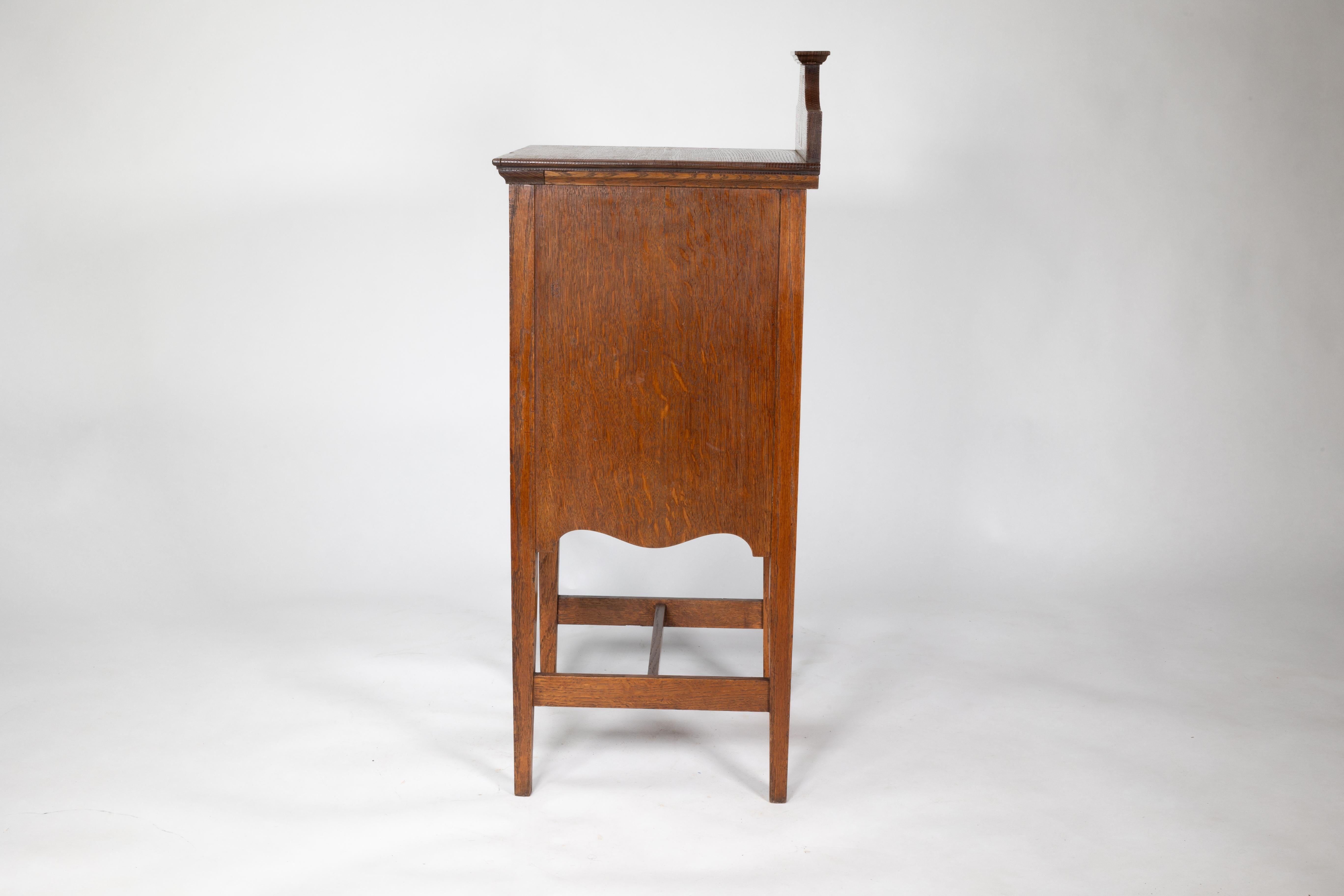Oak Shapland and Petter. An Arts and Crafts oak bedside cabinet For Sale