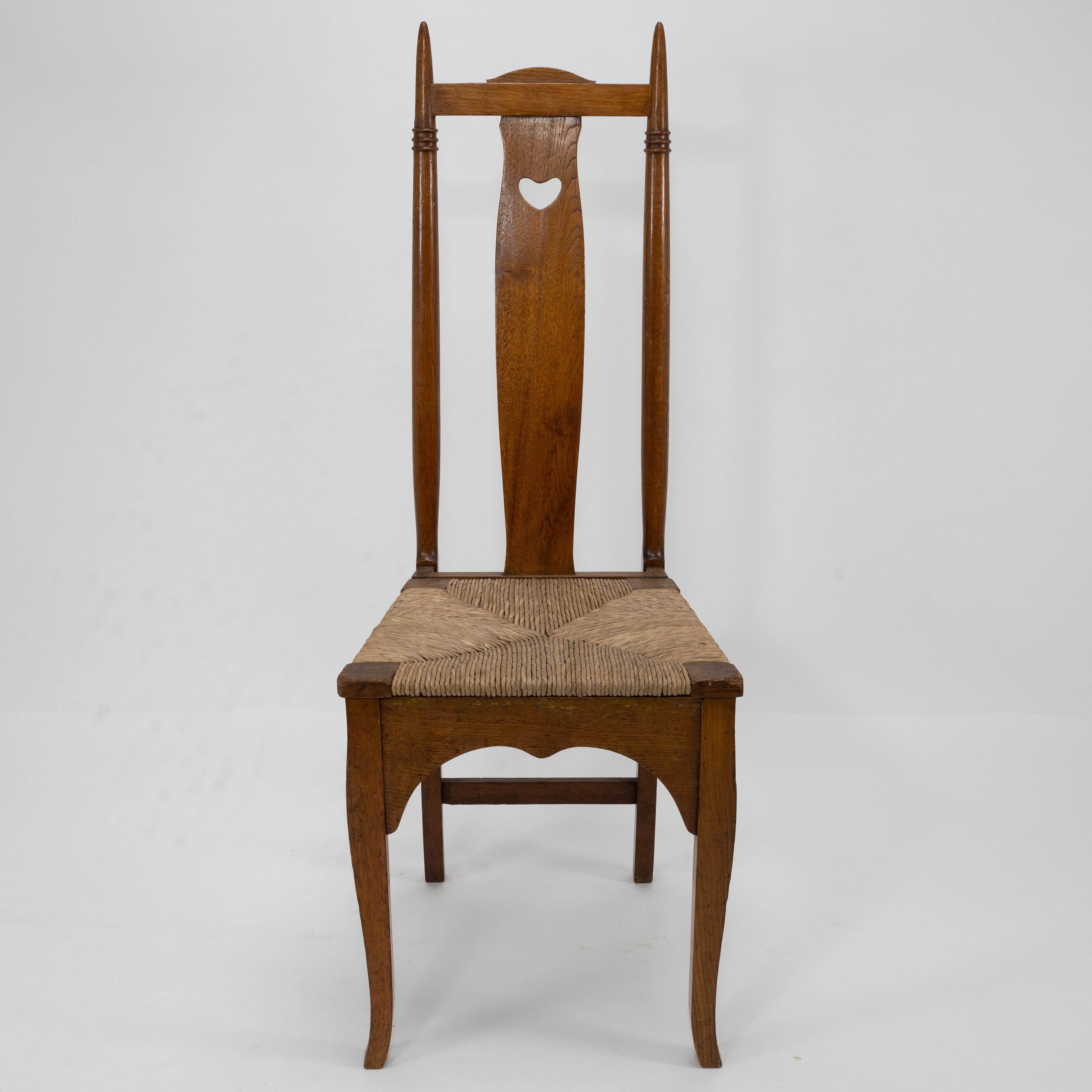 Arts and Crafts Shapland & Petter a Pair of Arts & Crafts Oak Dining Chairs with Pierced Hearts For Sale