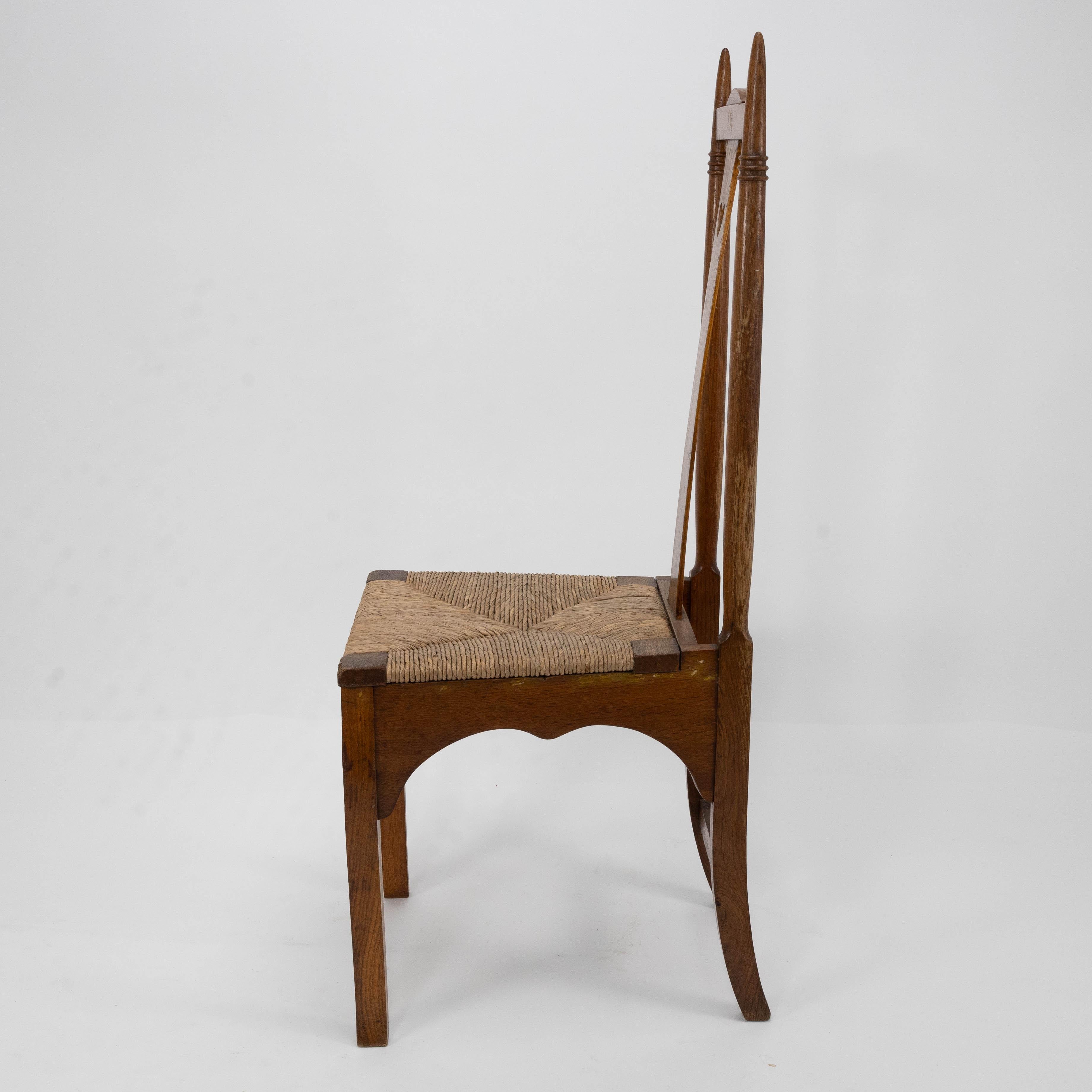 Hand-Crafted Shapland & Petter a Pair of Arts & Crafts Oak Dining Chairs with Pierced Hearts For Sale
