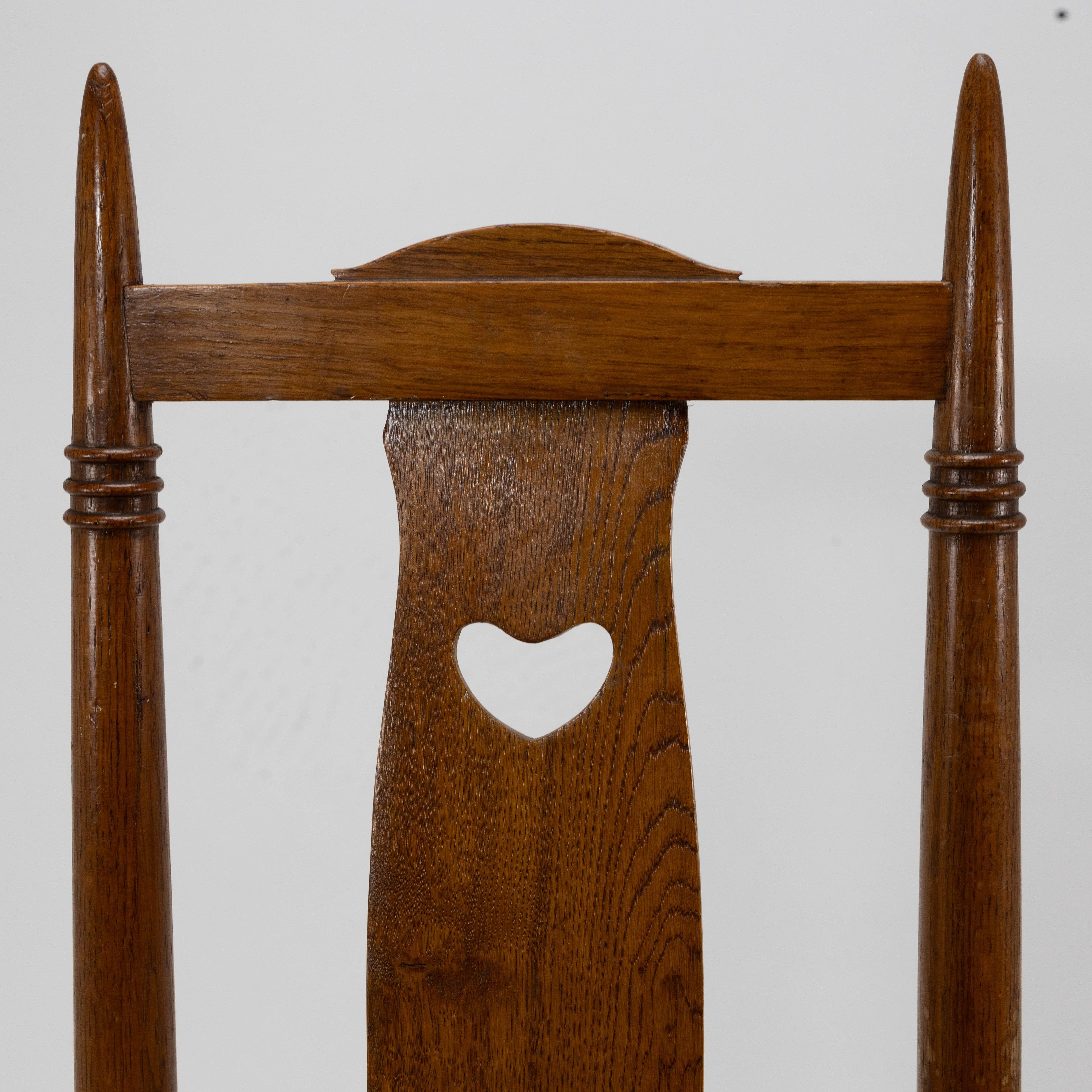 Shapland & Petter a Pair of Arts & Crafts Oak Dining Chairs with Pierced Hearts In Good Condition For Sale In London, GB